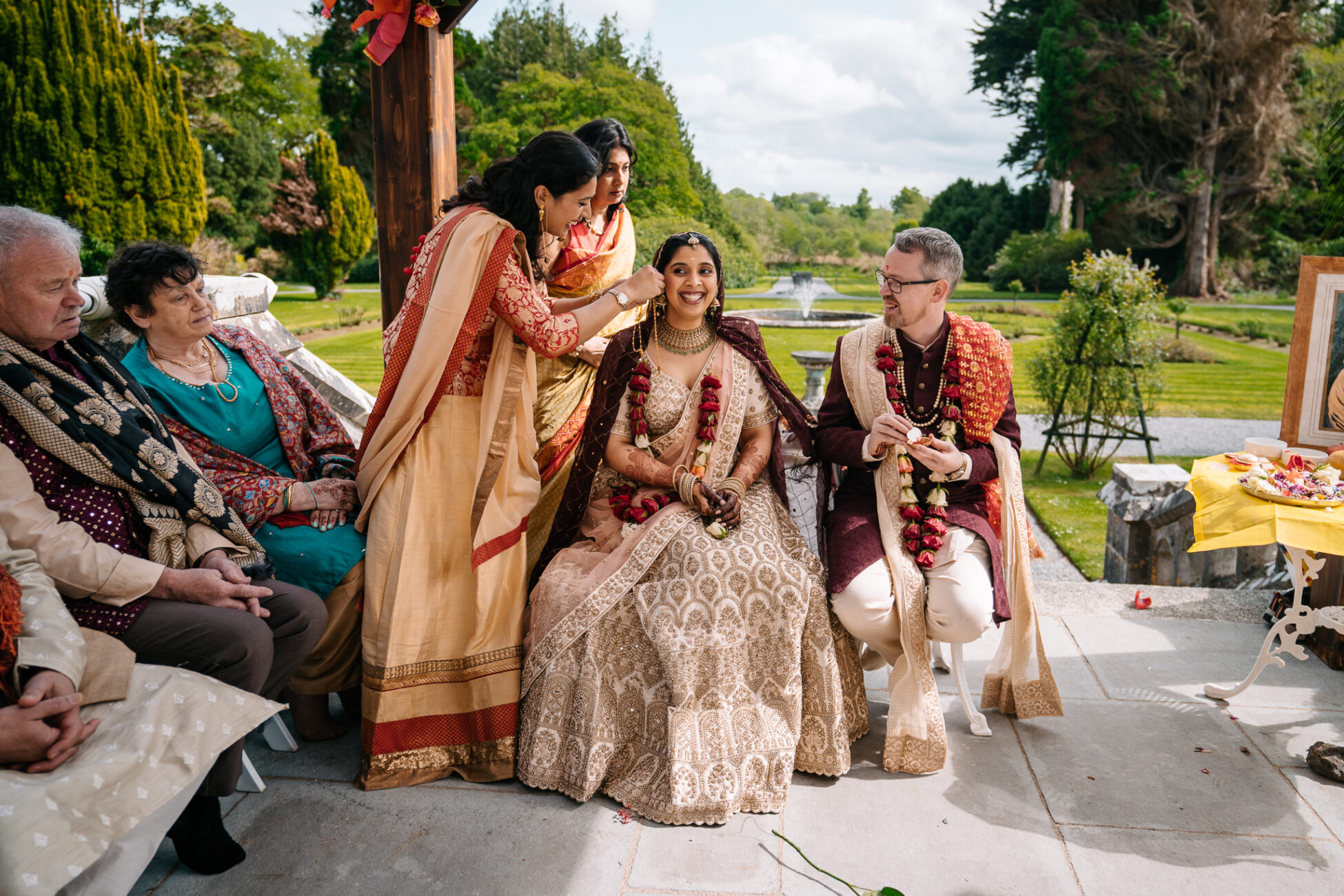 A group of people sitting outside