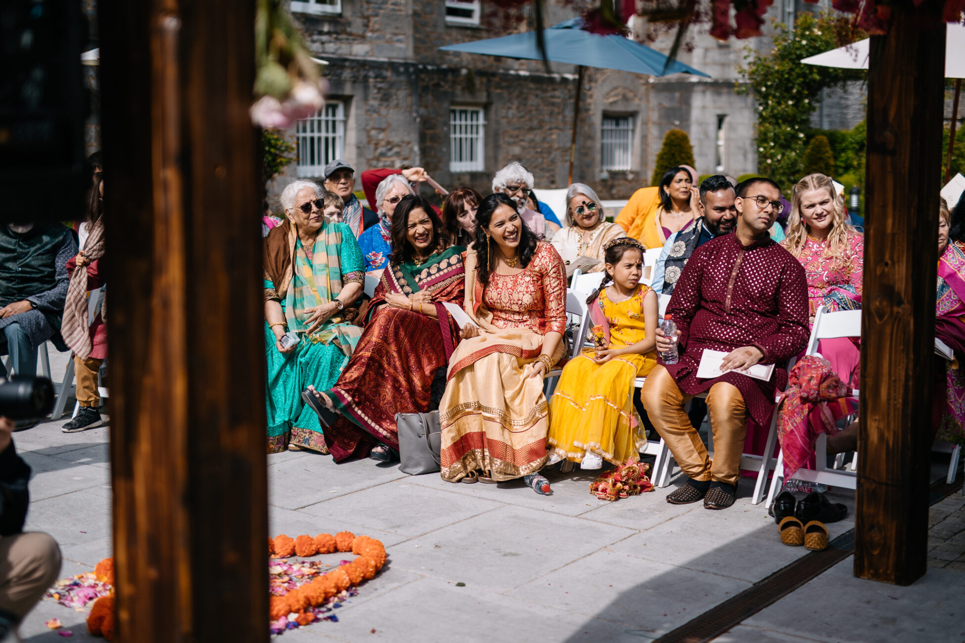 A group of people sitting outside