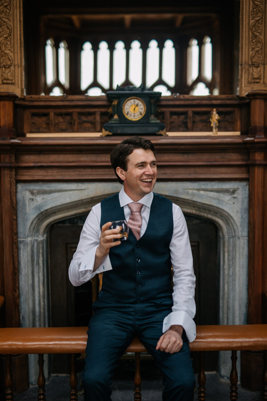 A person in a suit and tie sitting on a bench