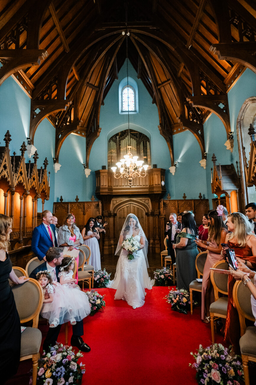 A bride and groom walking down the aisle