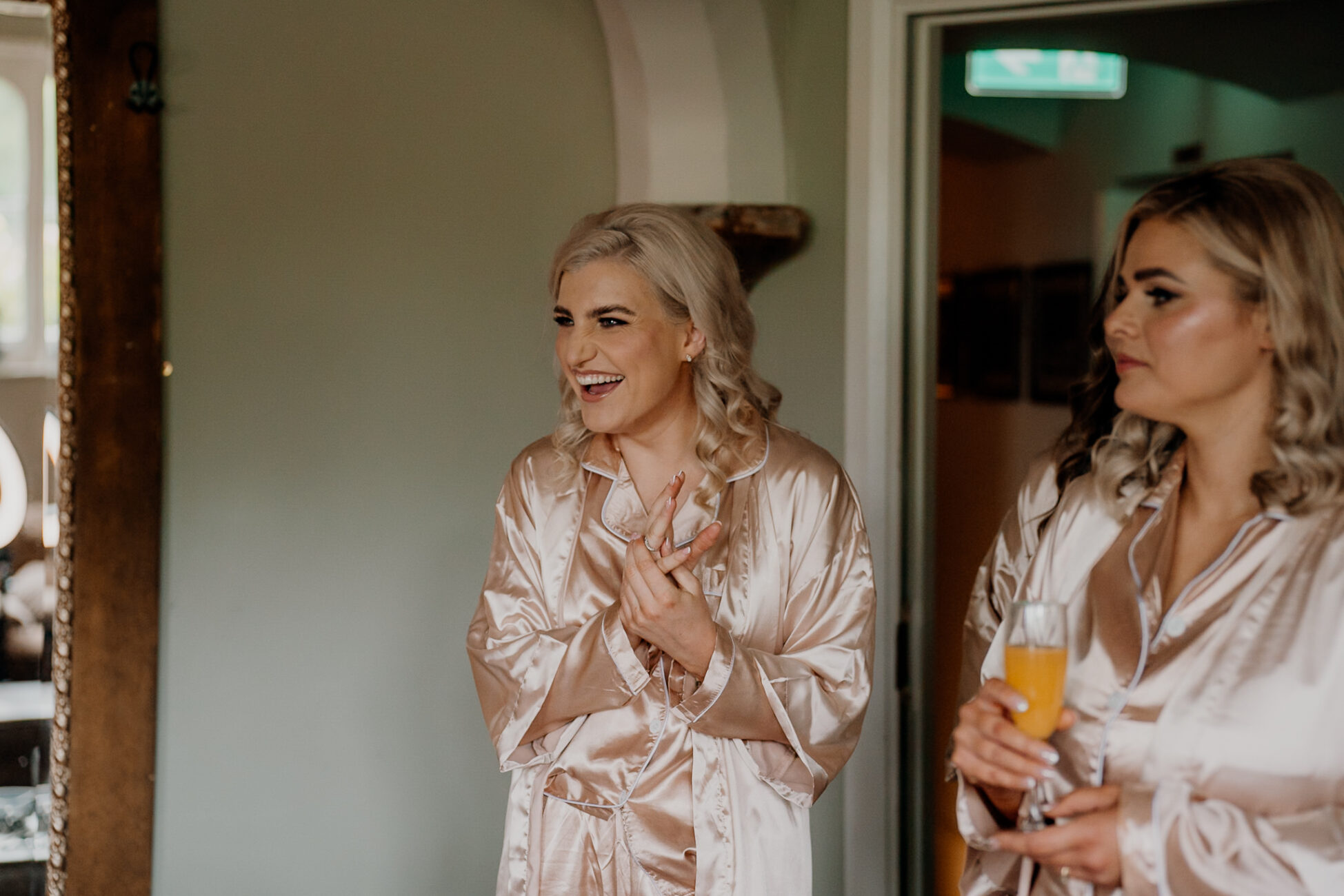 A couple of women holding glasses of beer