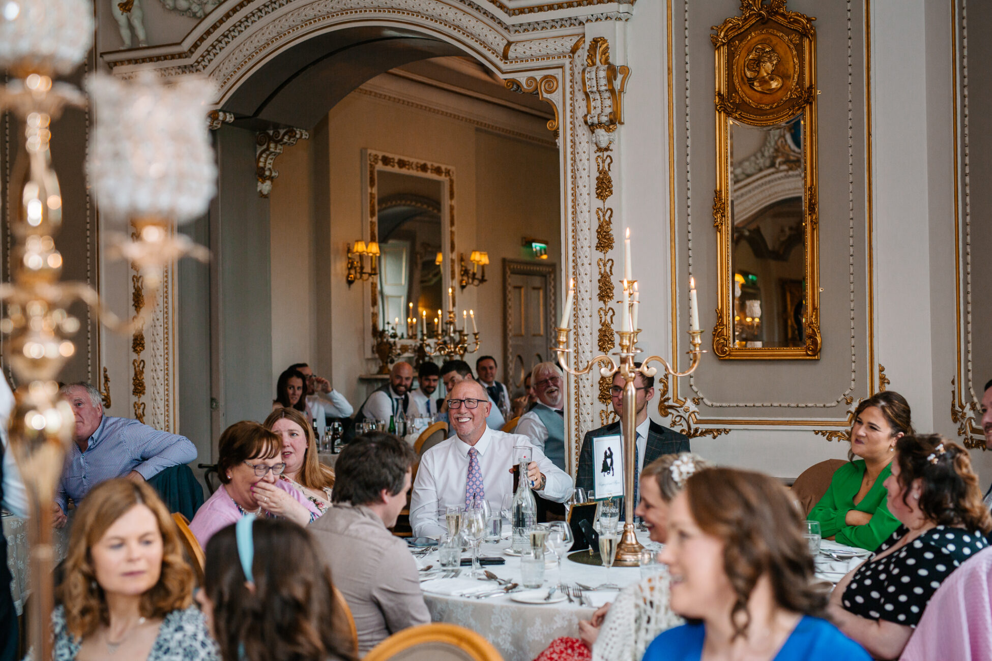 A group of people sitting at tables