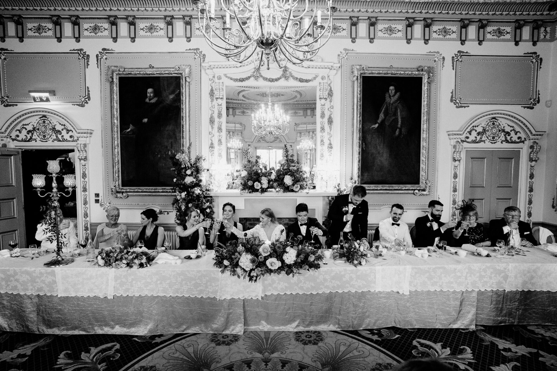 A group of people sitting on the floor in front of a fireplace