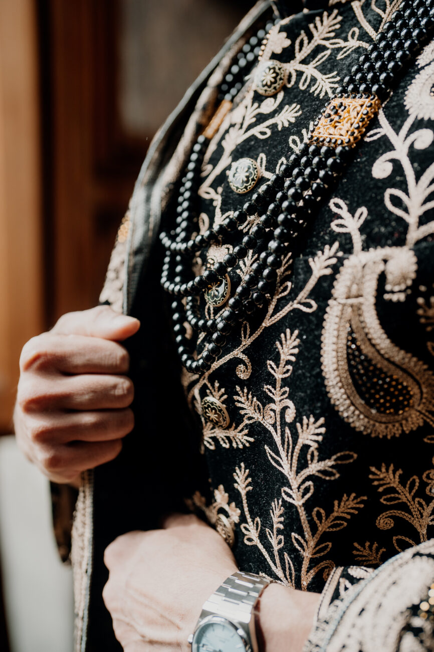 A person holding a black and white dress