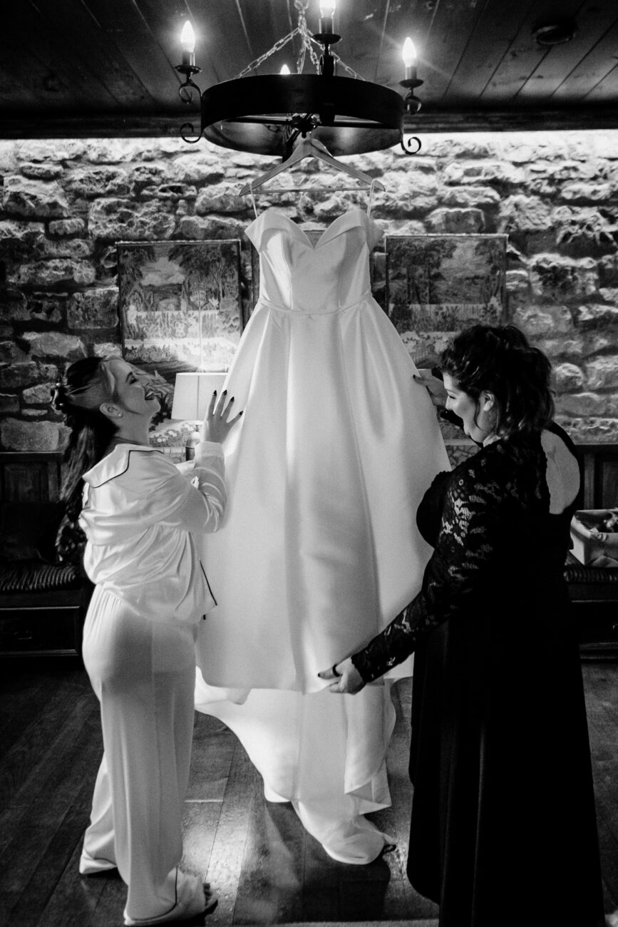 A person getting the wedding dress done