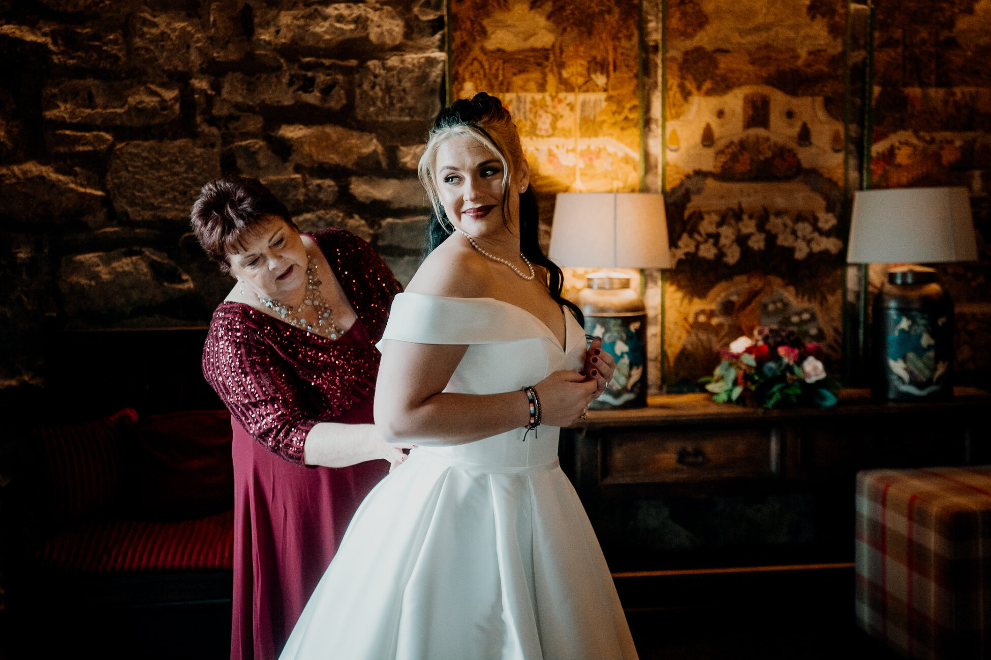 A woman in a white dress and a woman in a red dress