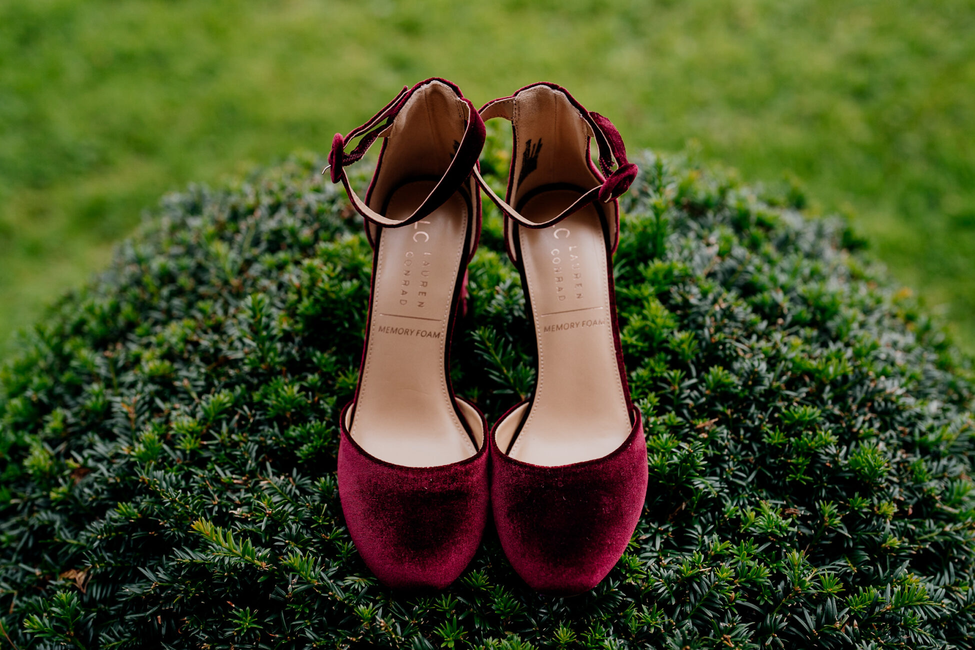 A pair of red shoes on grass