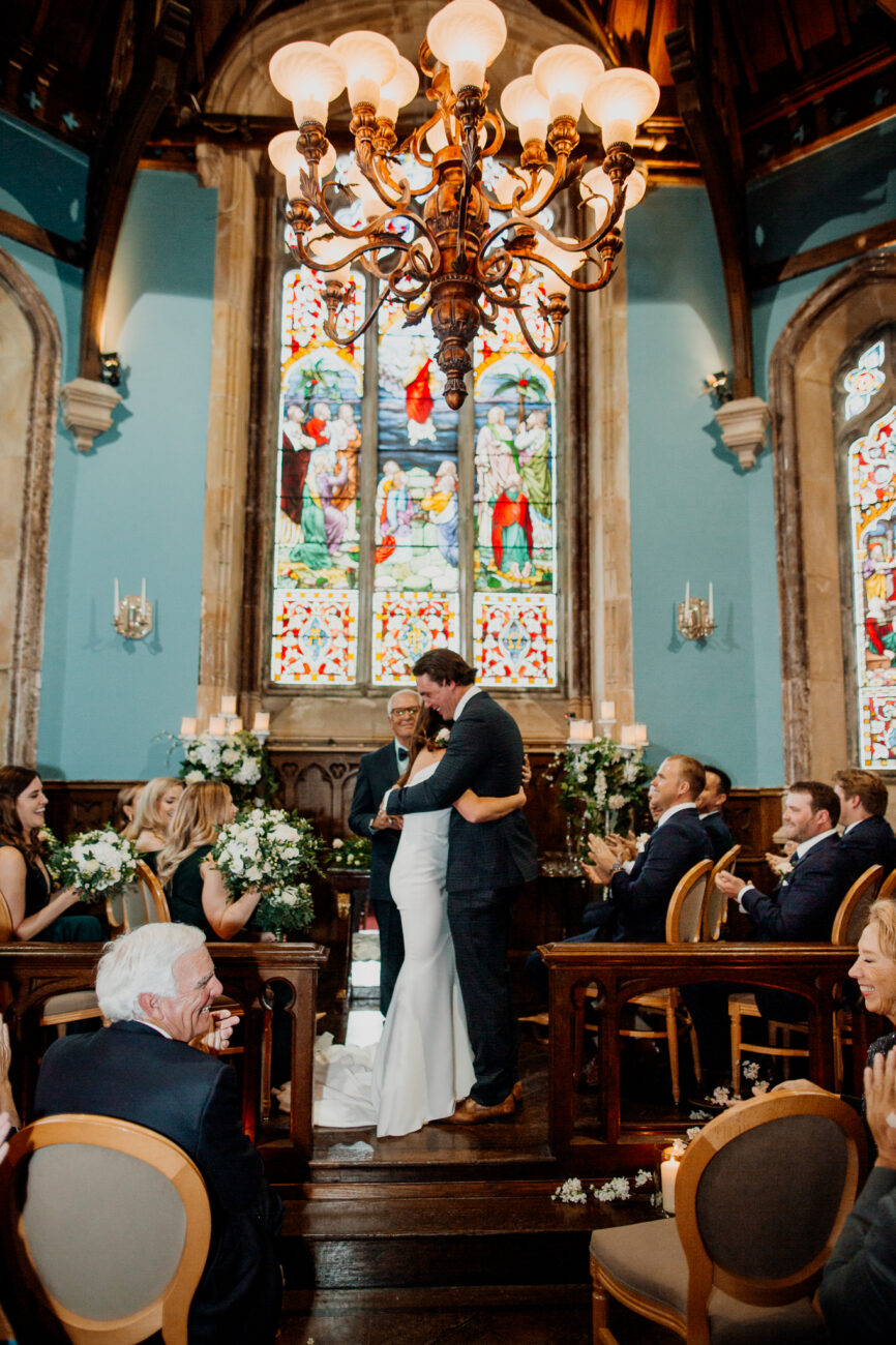 A man and woman kissing in a church