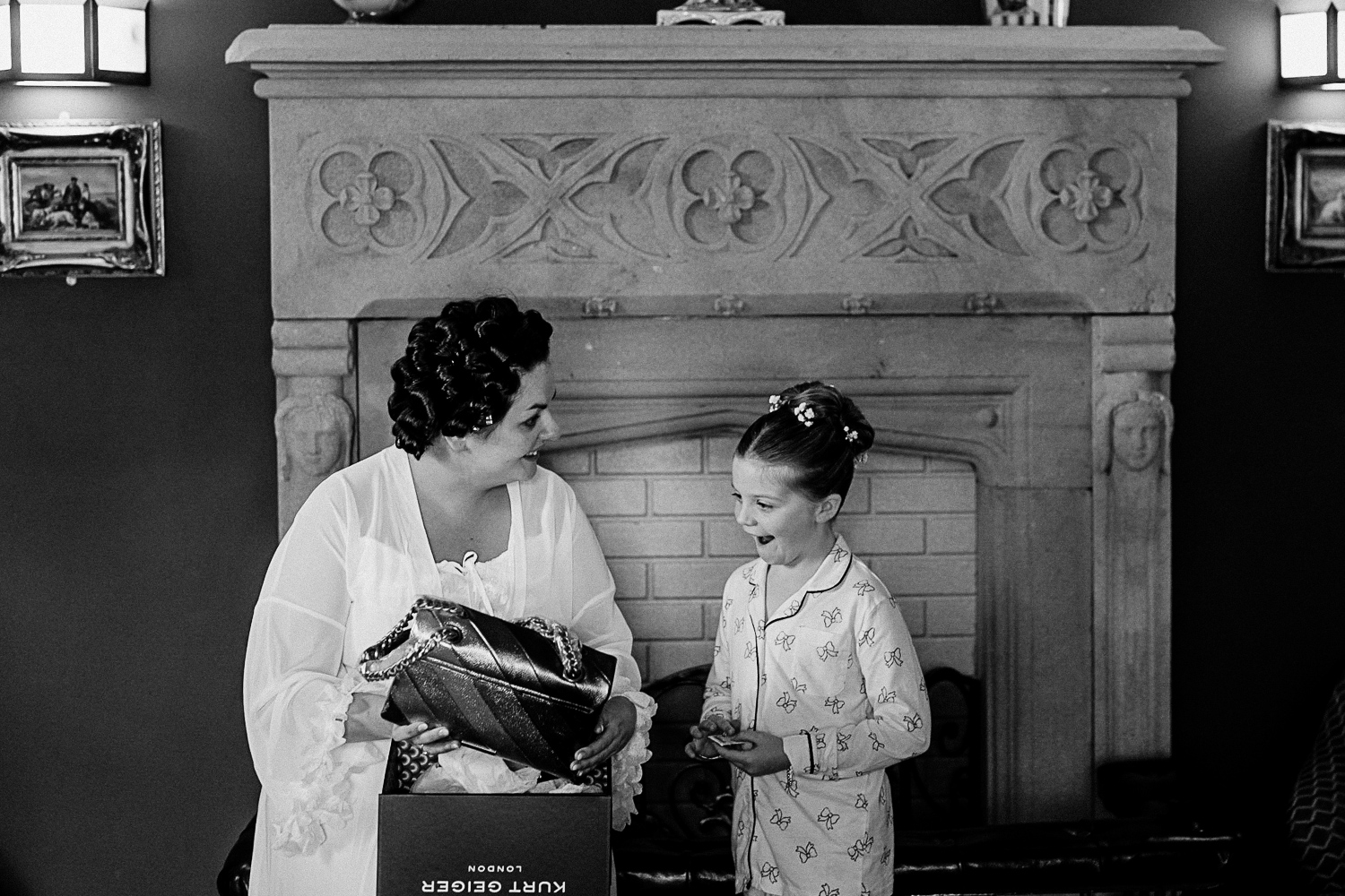 A person and a child looking at a book