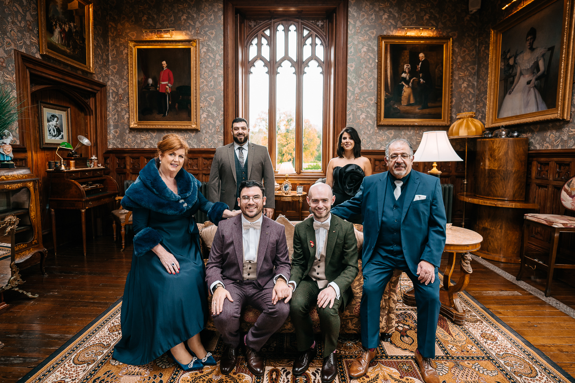 A group of people posing for a photo in a room