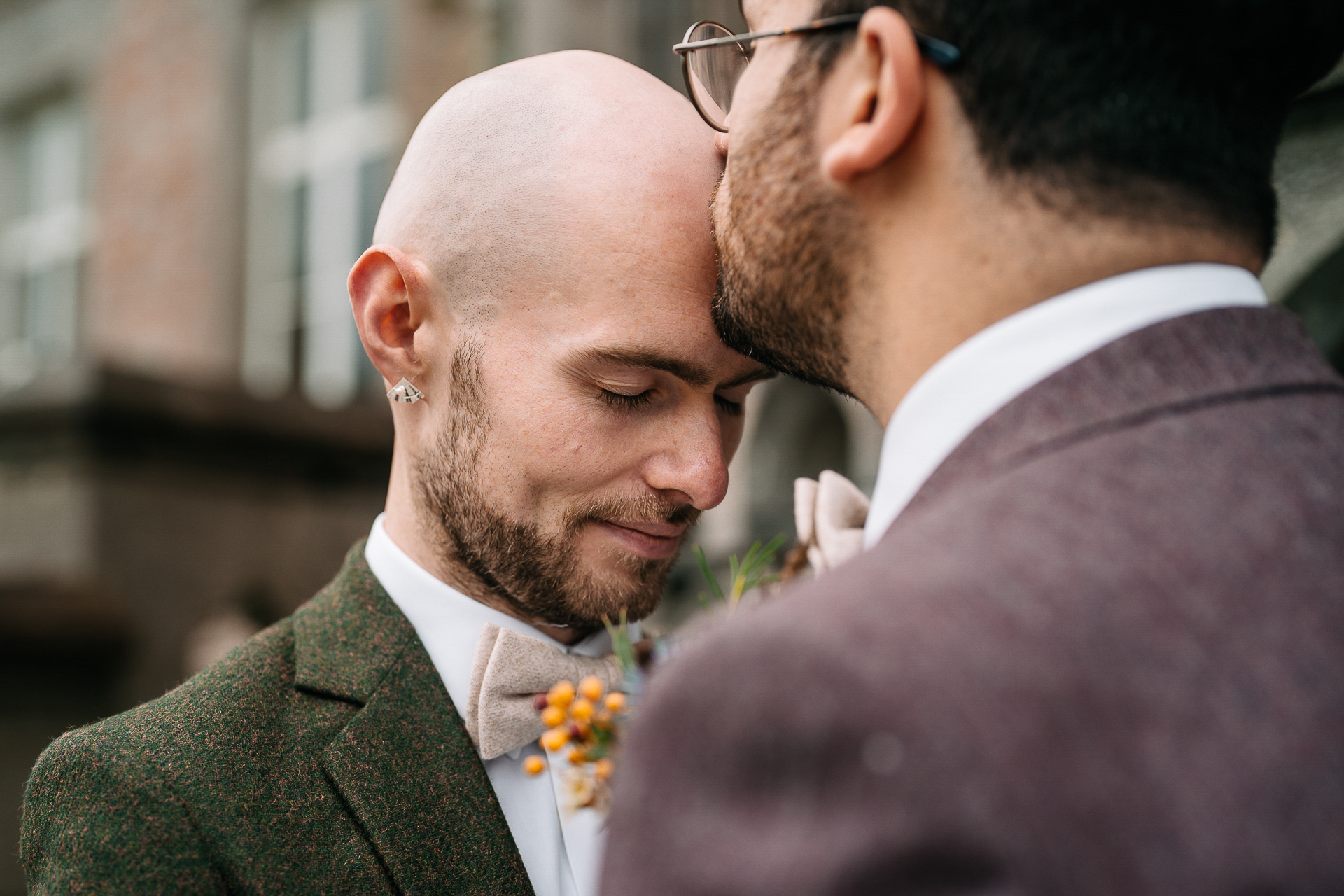 A man kissing another man