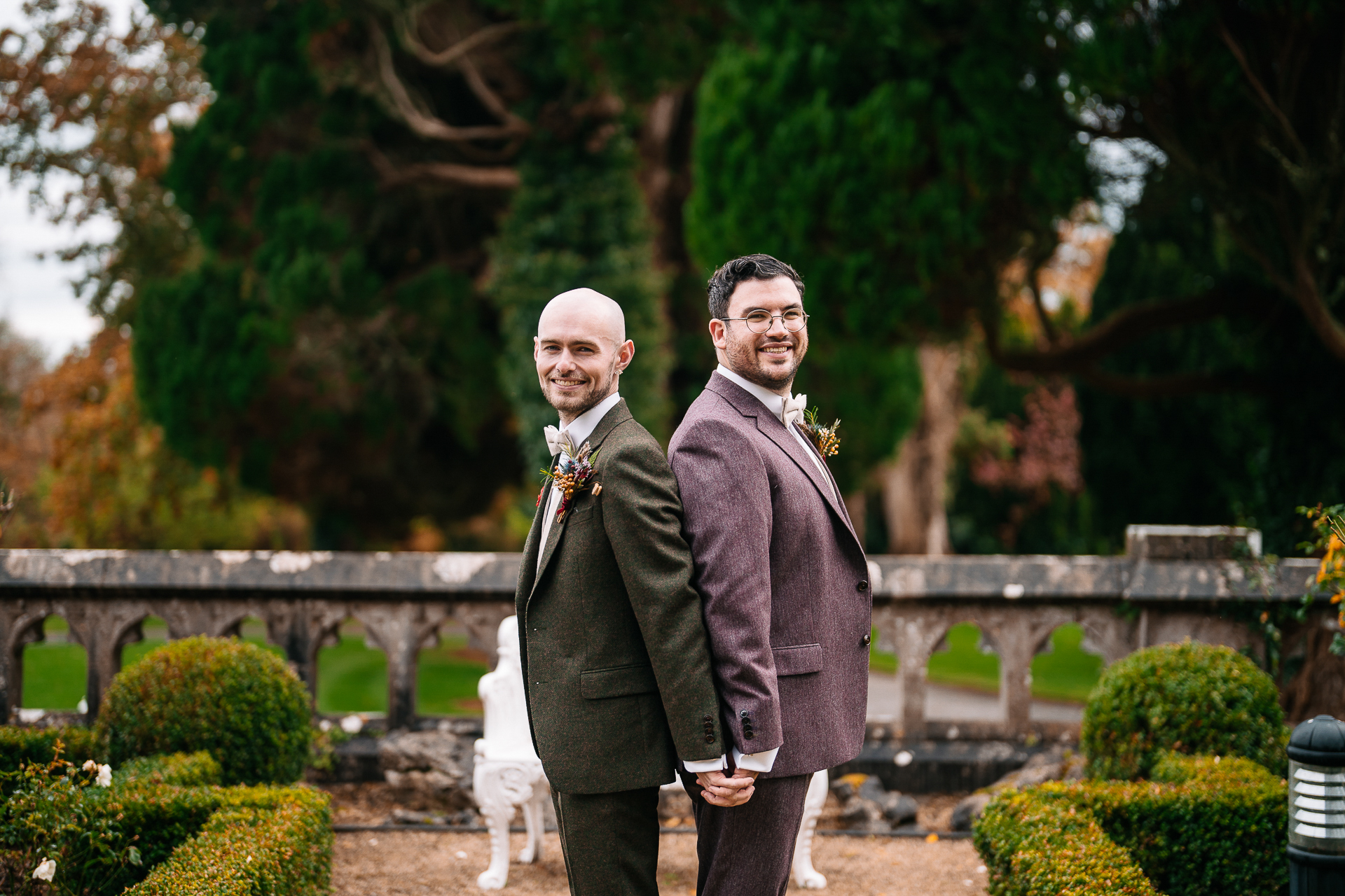 A person in a suit and a person in a tuxedo