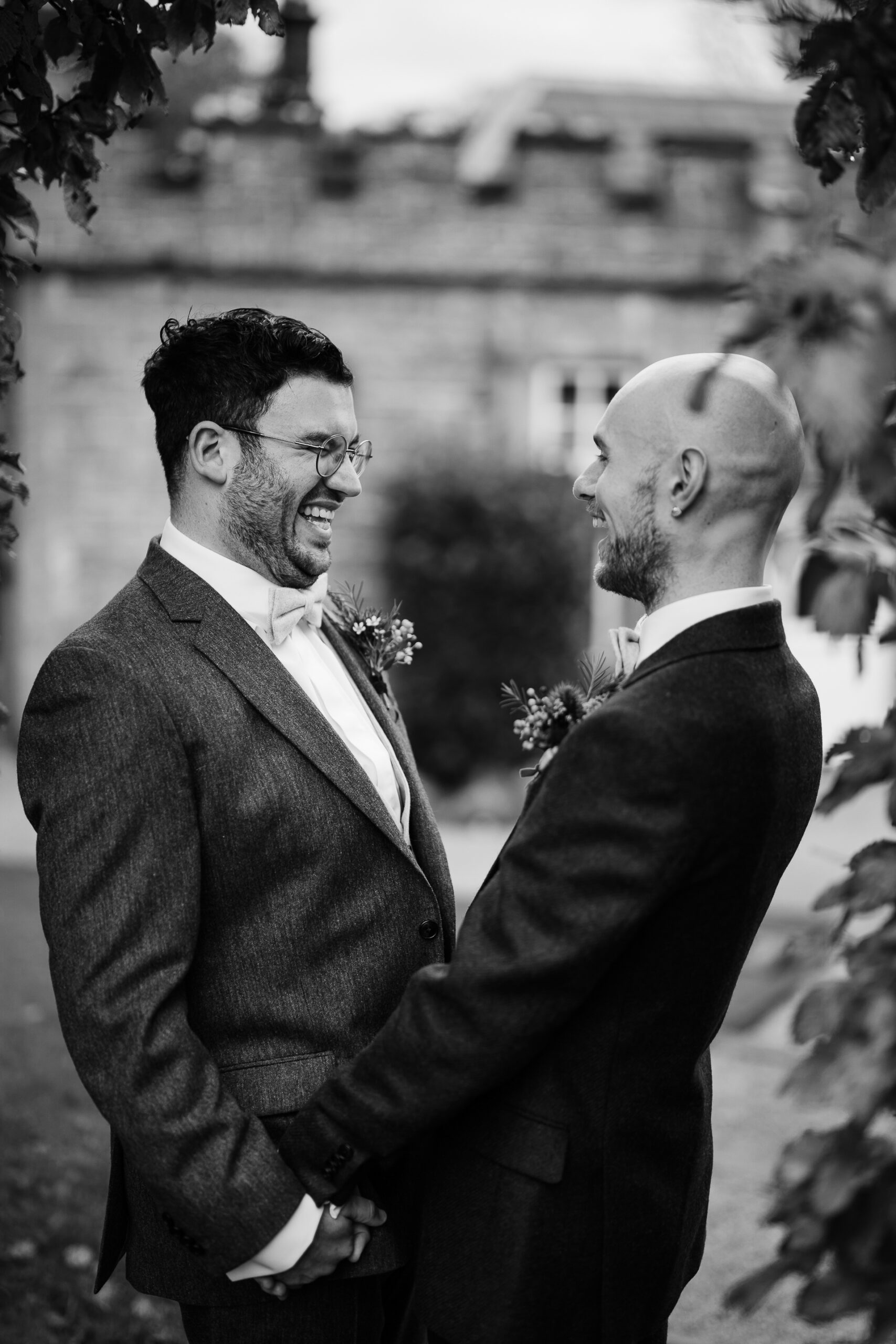 A man in a suit shaking hands with another man in a suit