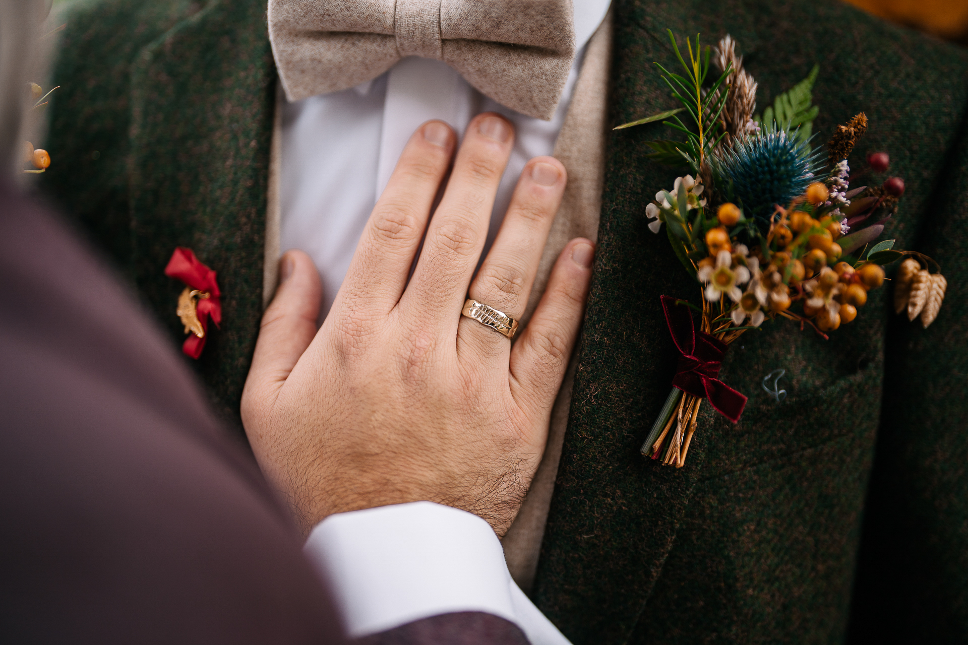 A person's hand with a ring on it