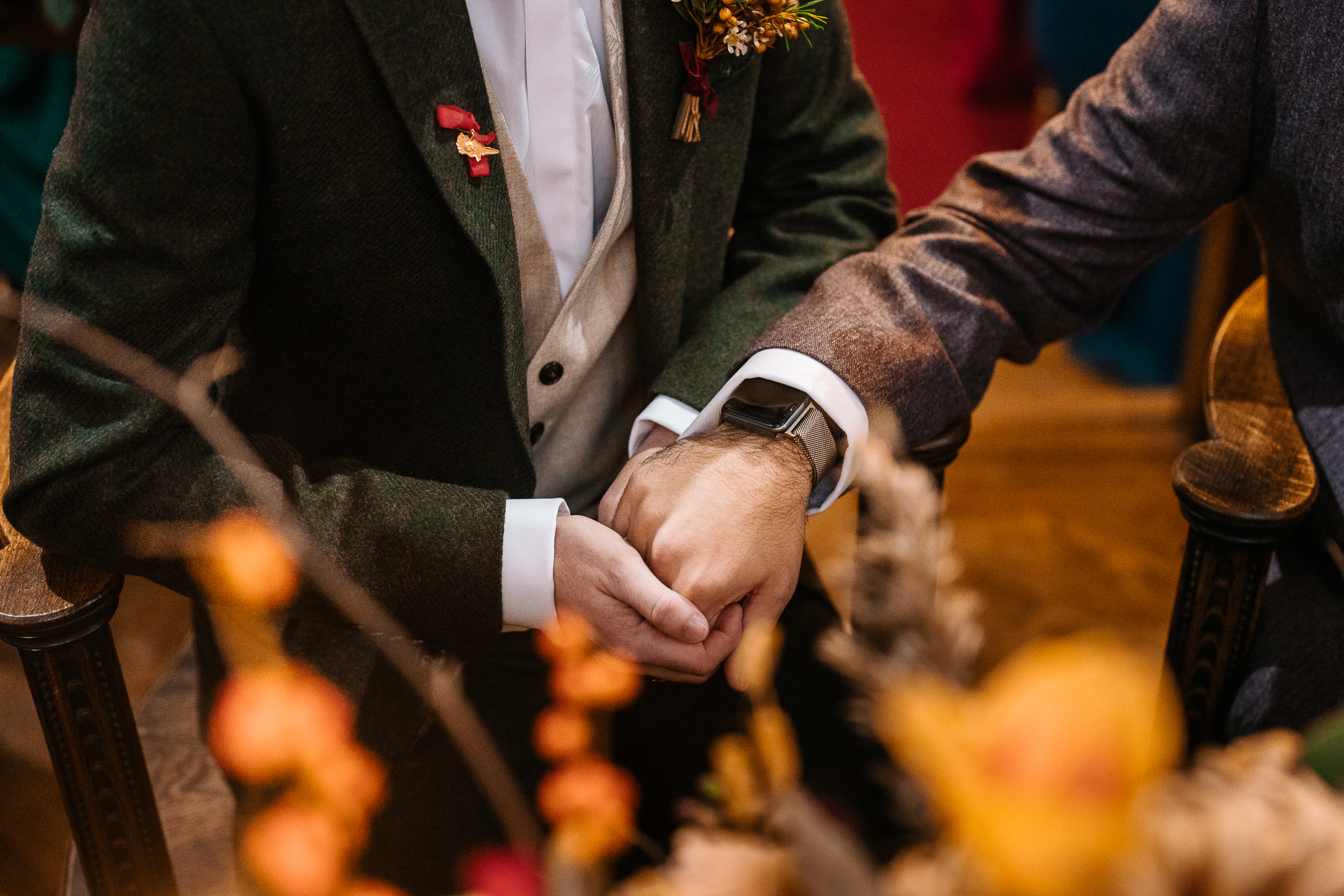 A man in a suit and tie holding a stick