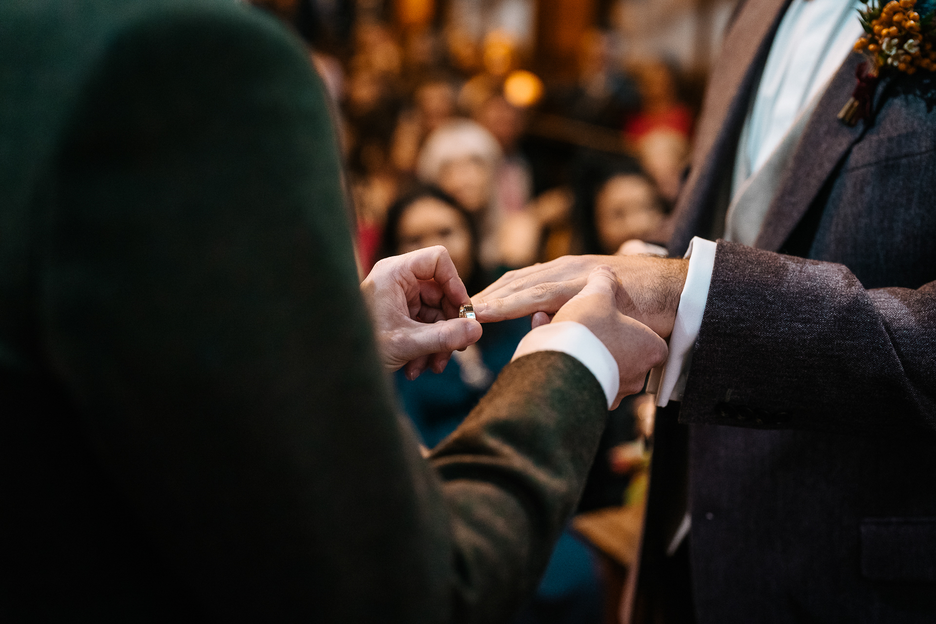 A couple of people in suits holding hands