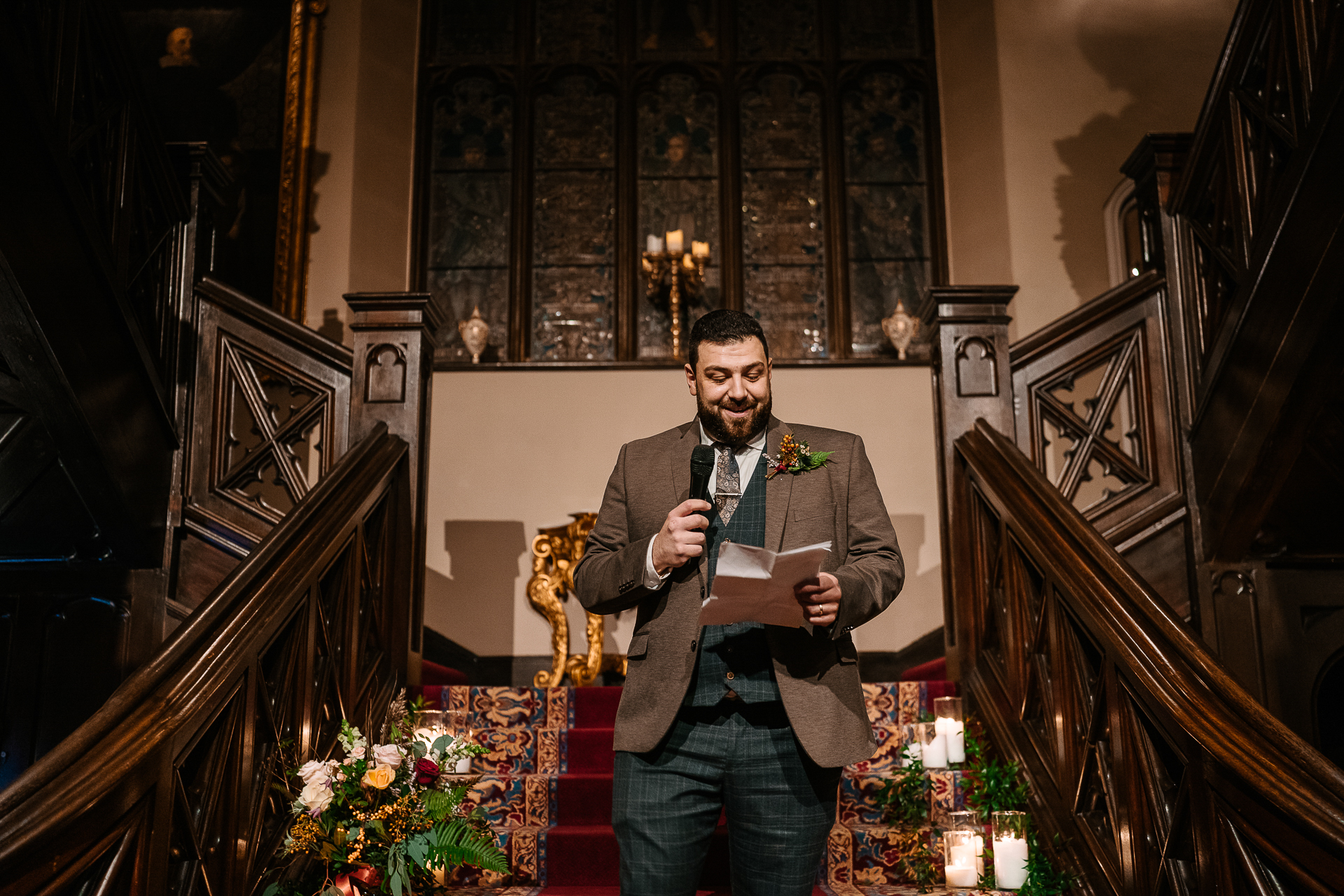 A woman in a suit holding a microphone in a church