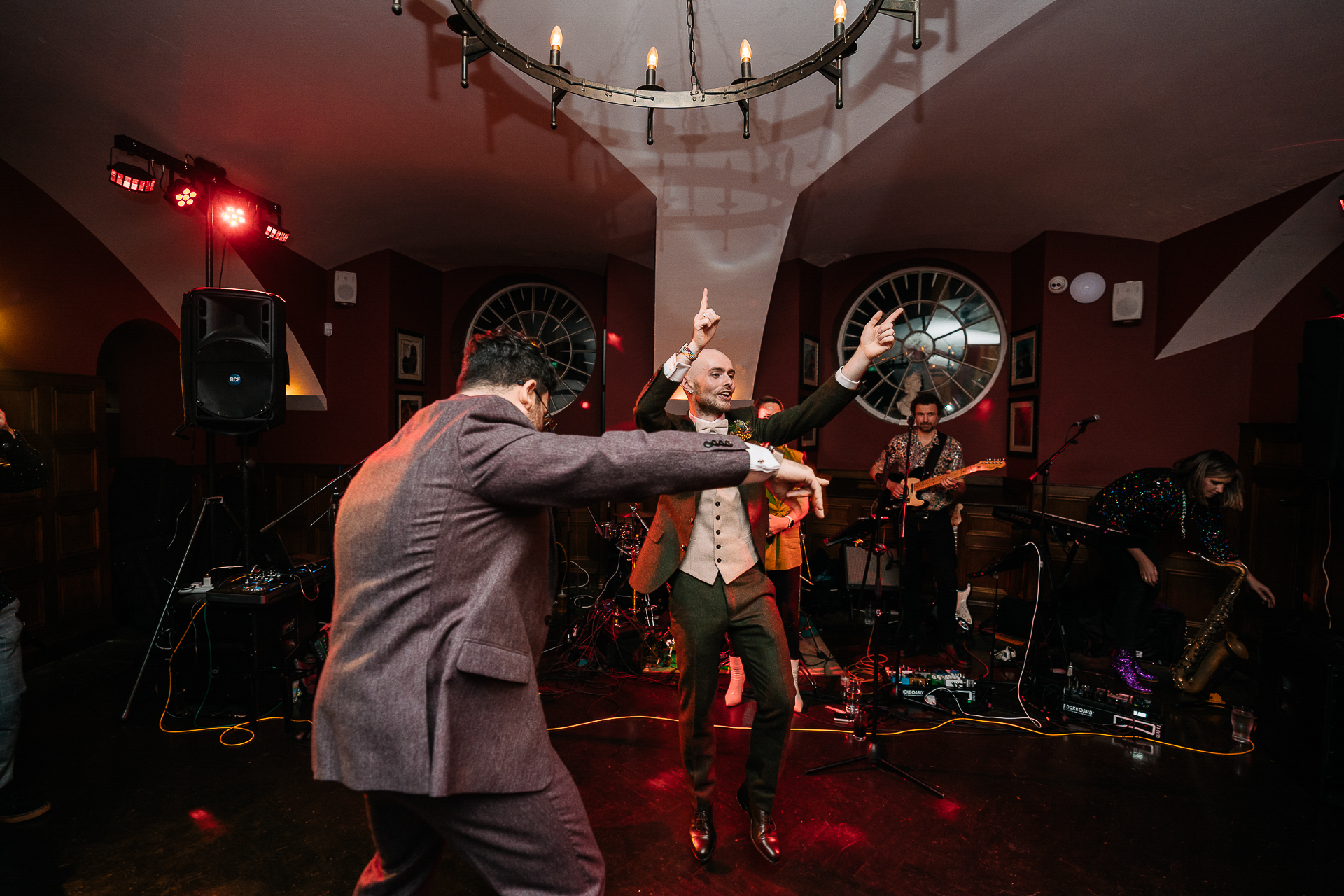 A group of people playing instruments on a stage