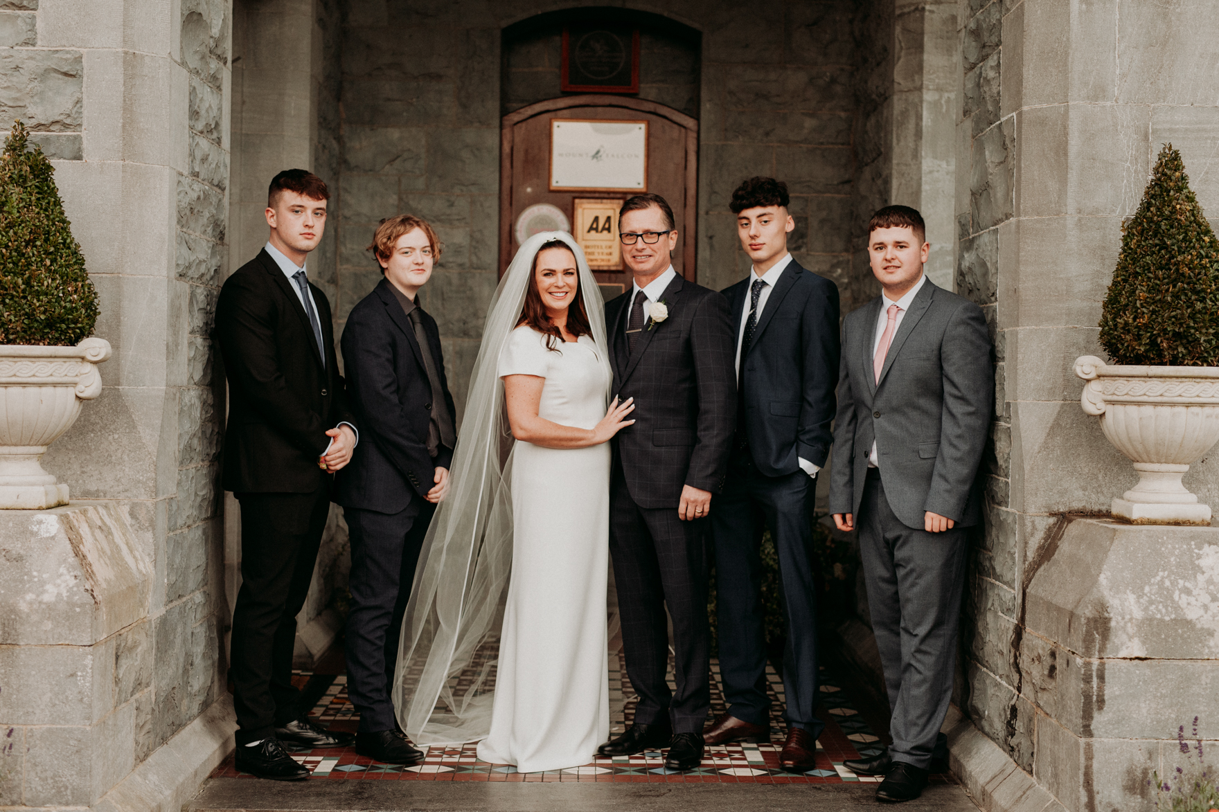 Megan Cavanagh et al. posing for a photo in front of a building