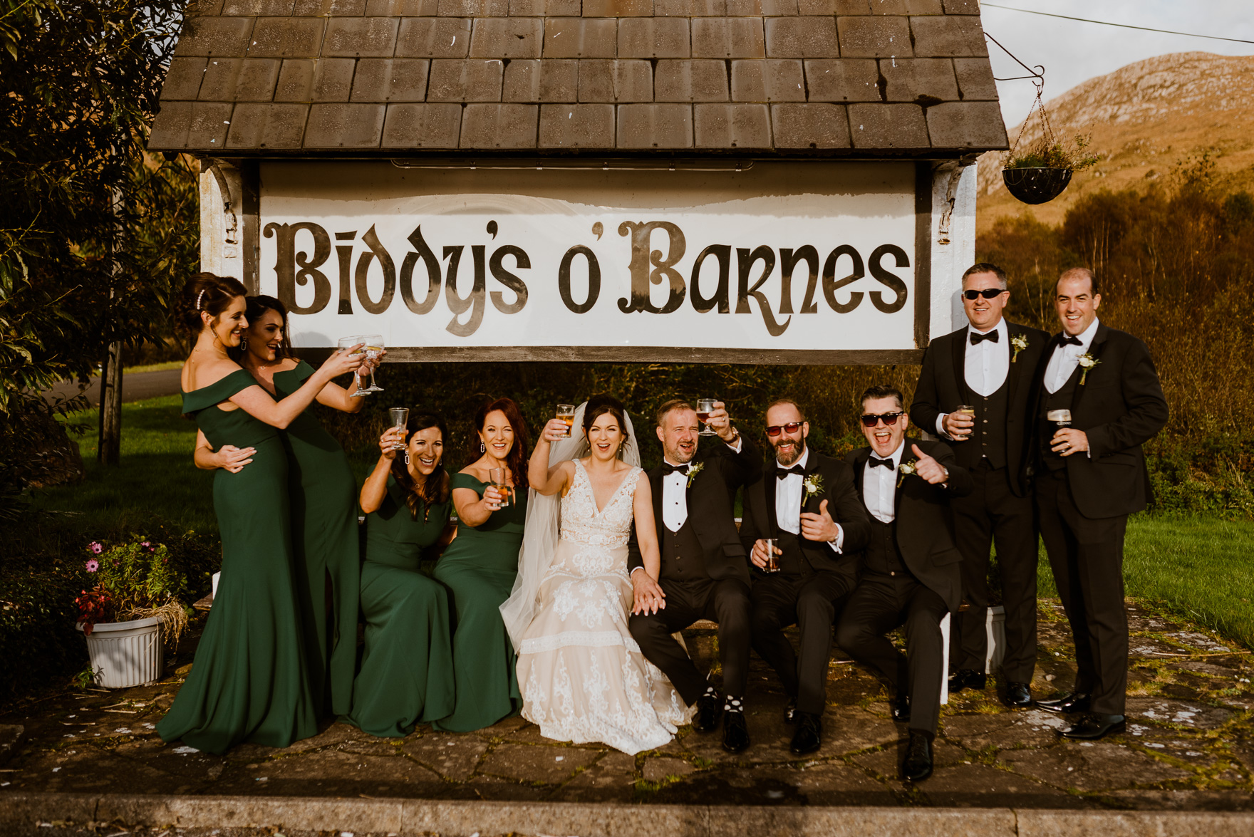 A group of people bridal party posing for a picture
