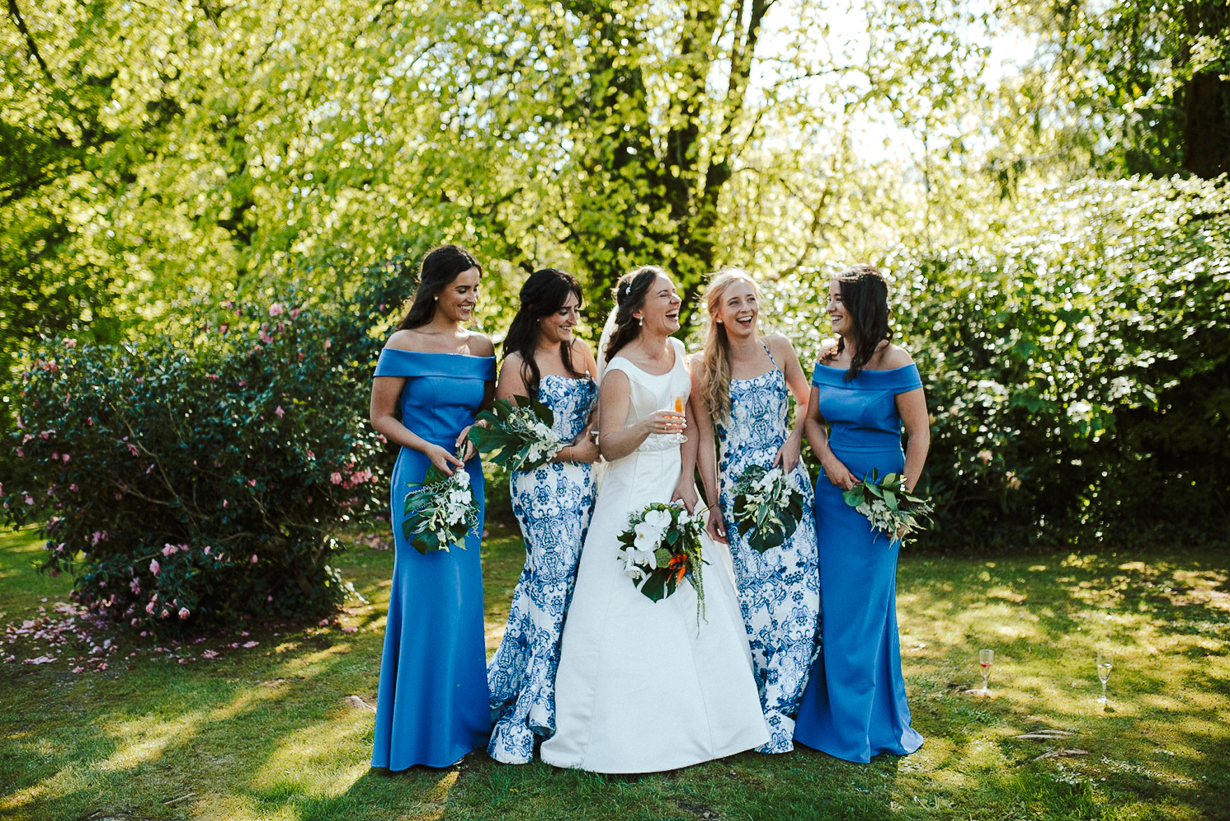 bridesmaids standing in a garden
