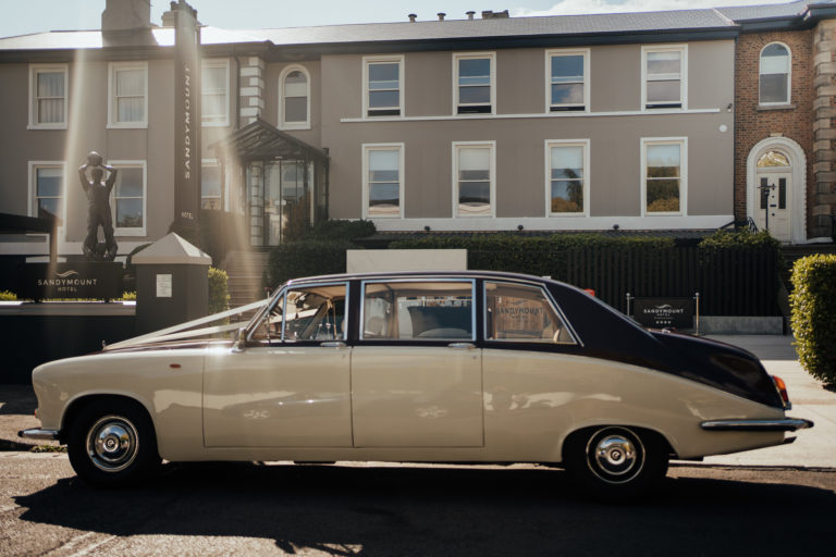 A car parked in front of a building