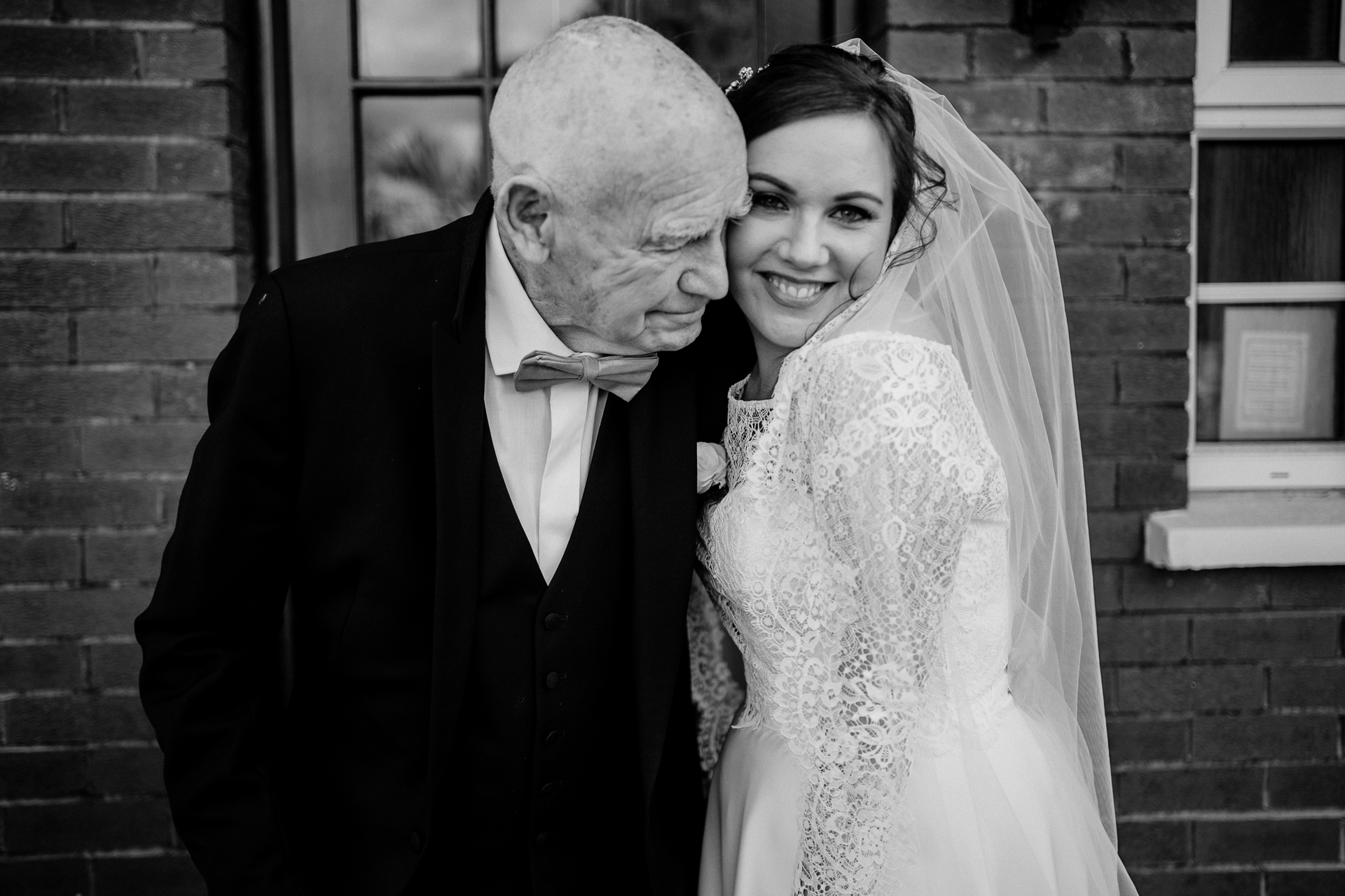 A bride and groom posing for a picture