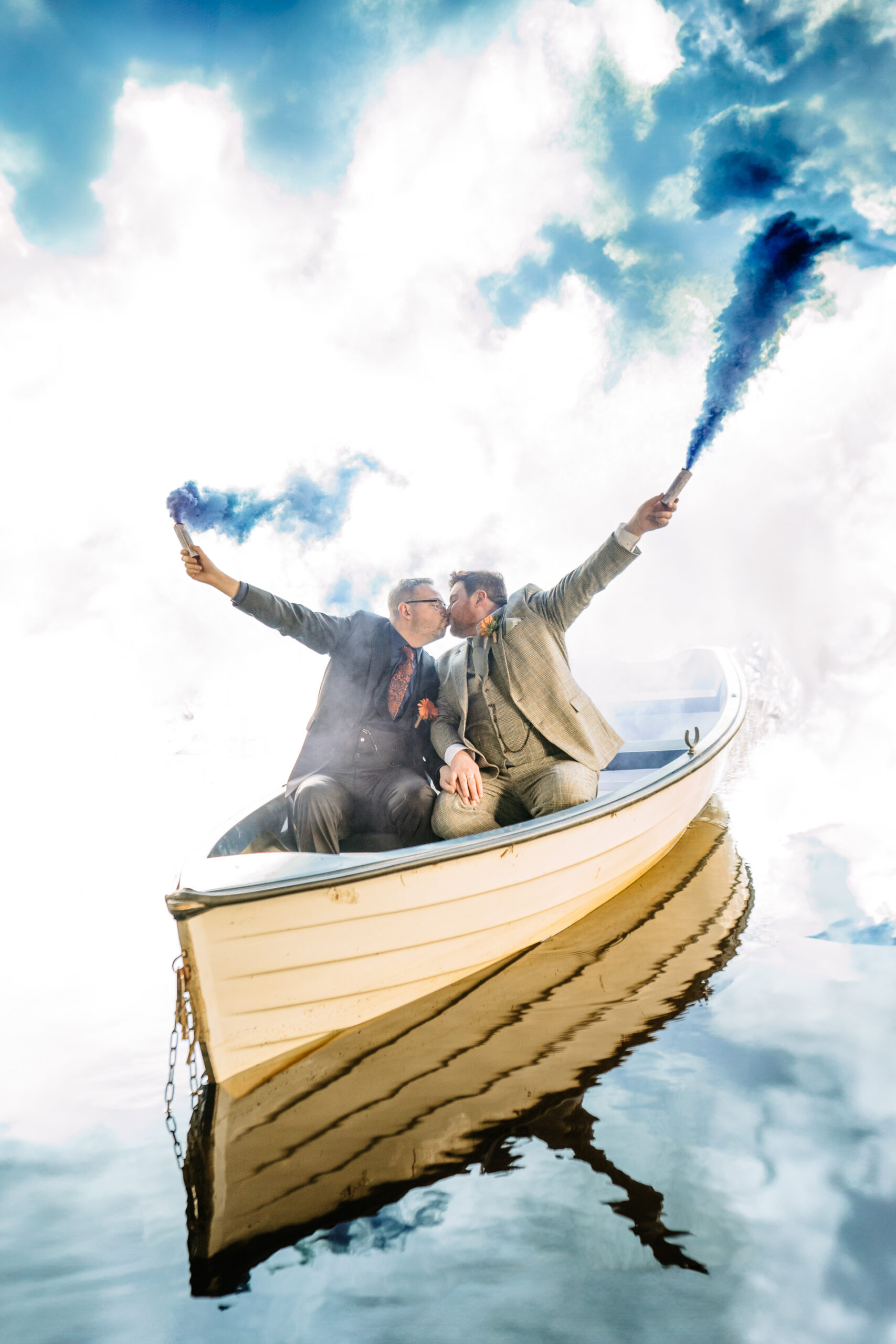 Romantic LGBT wedding portrait on a boat at Markree Castle with colourful smoke during an Irish destination celebration