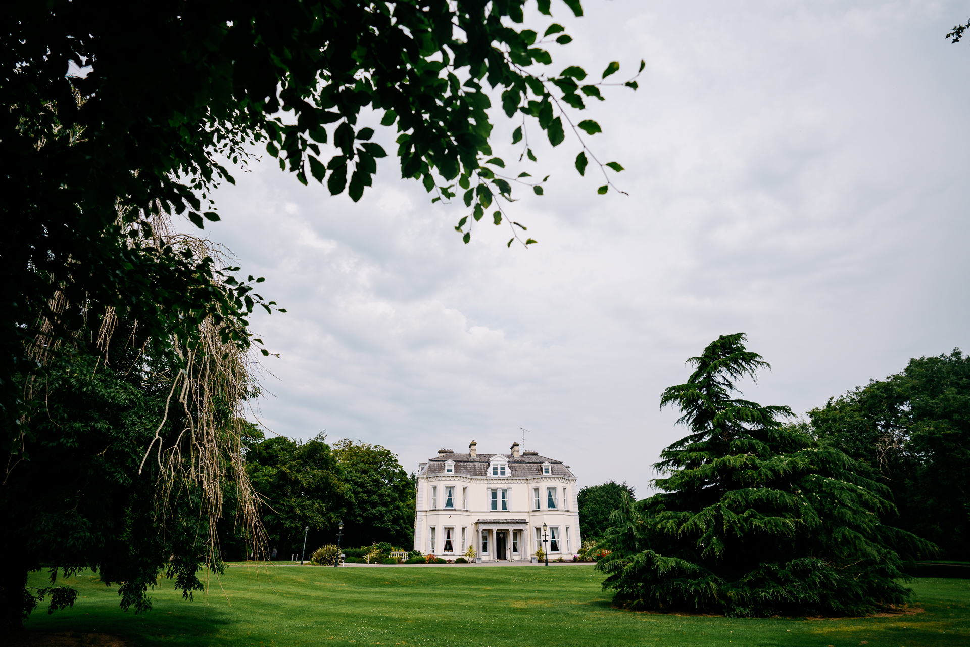 A white house surrounded by trees