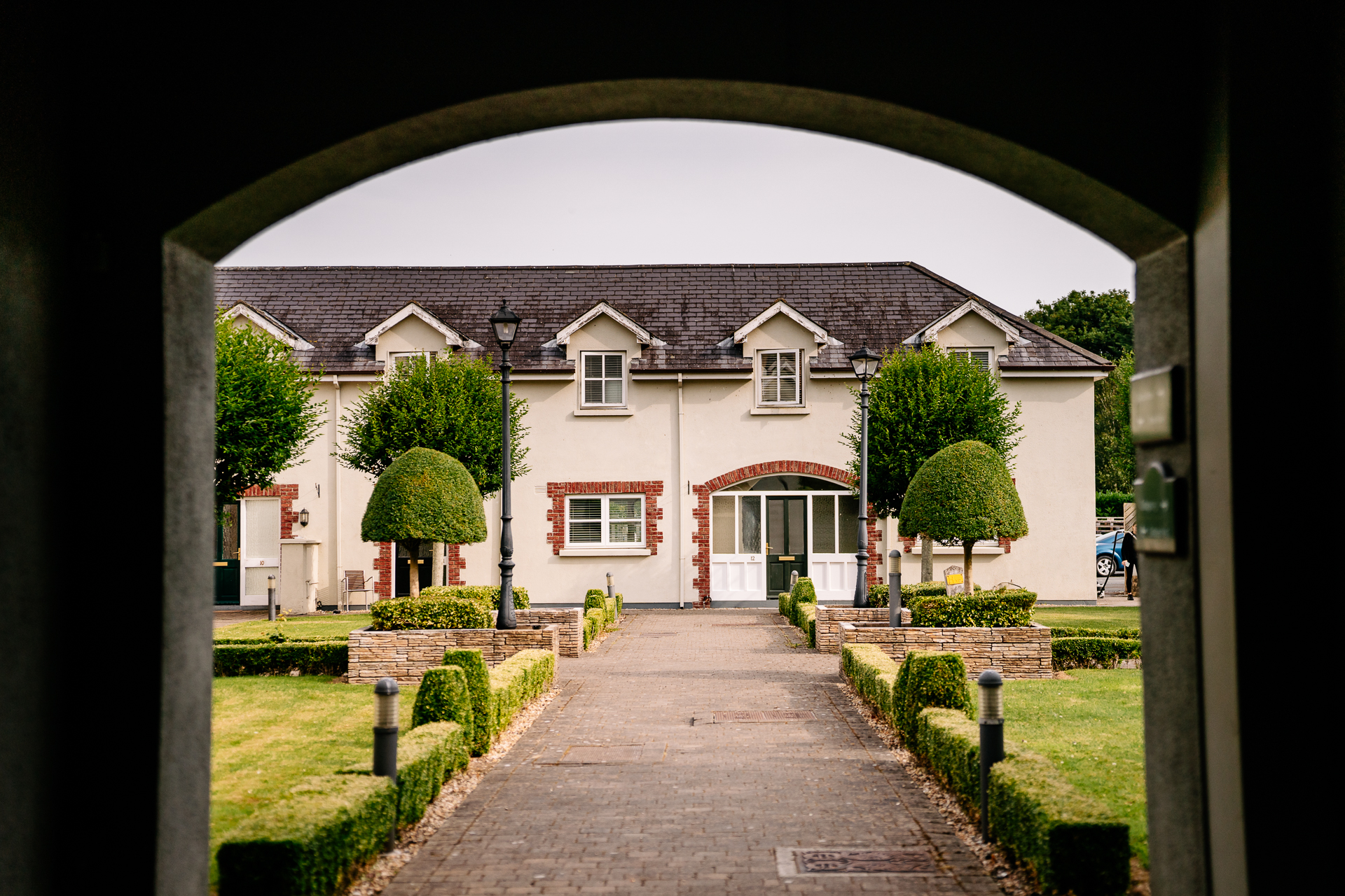 A stone walkway leading to a house