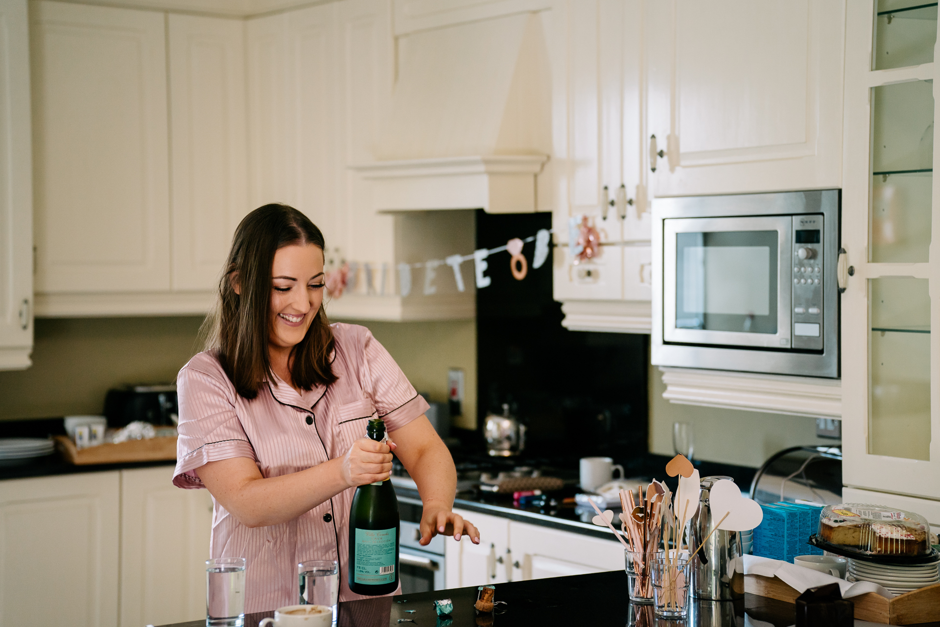 A woman holding a bottle of wine