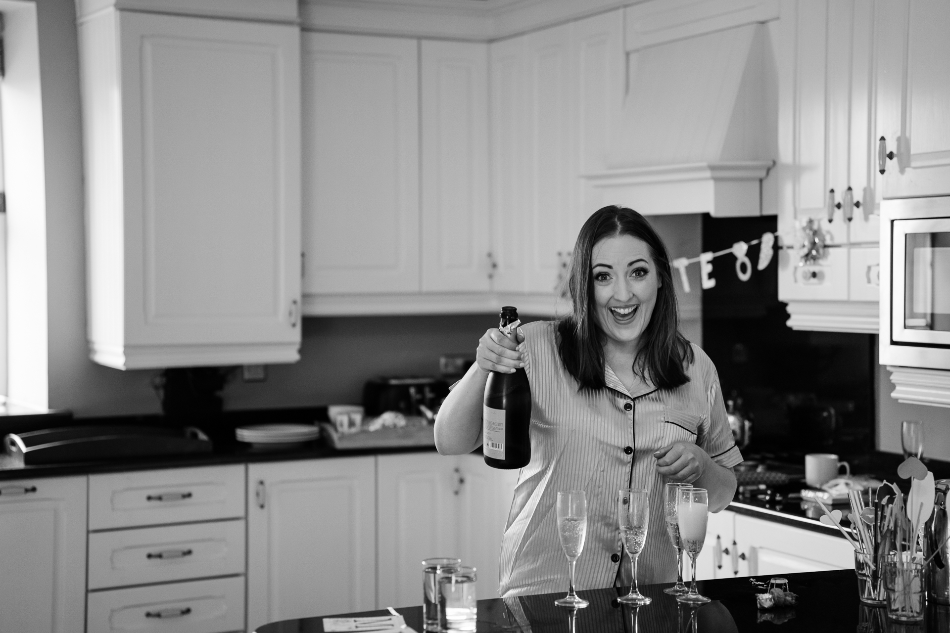 A woman holding a bottle of wine