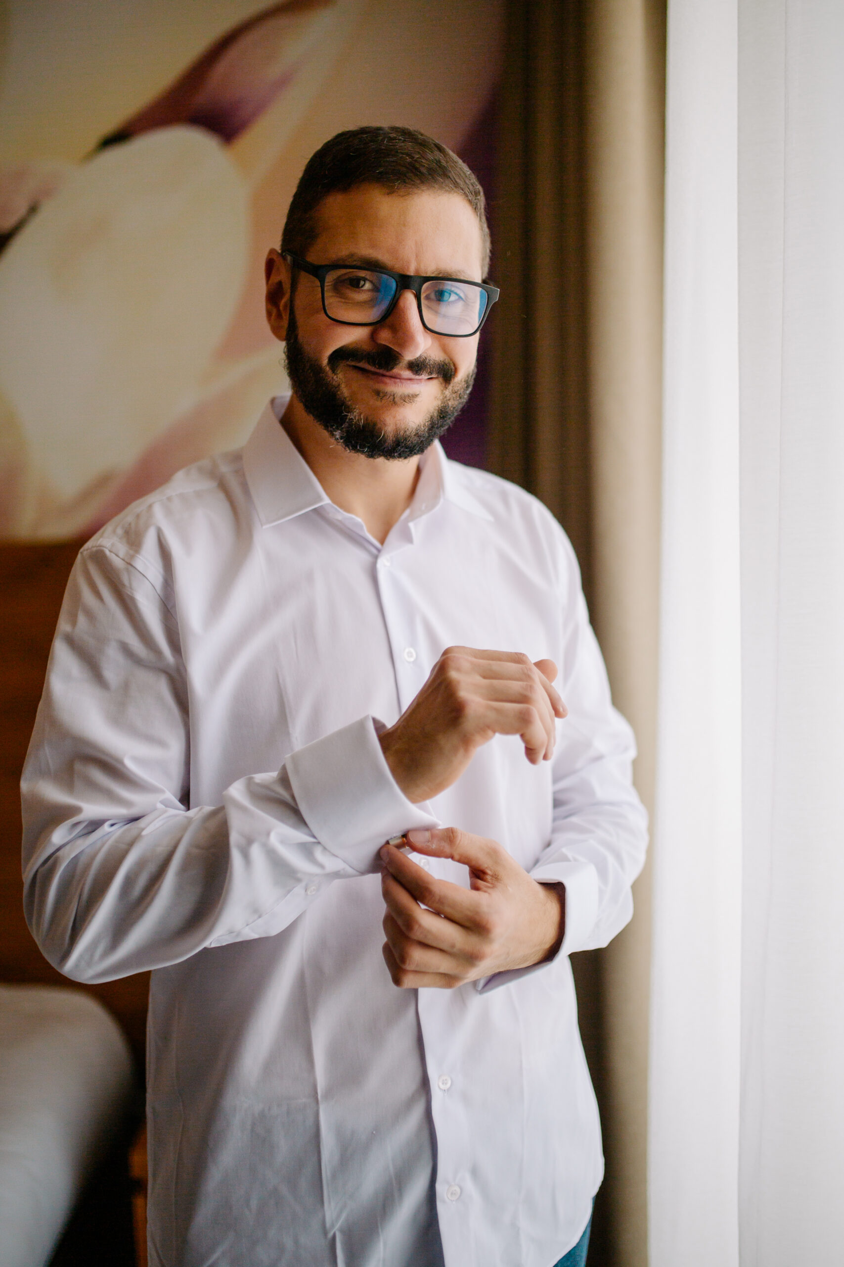 A man with glasses and a beard