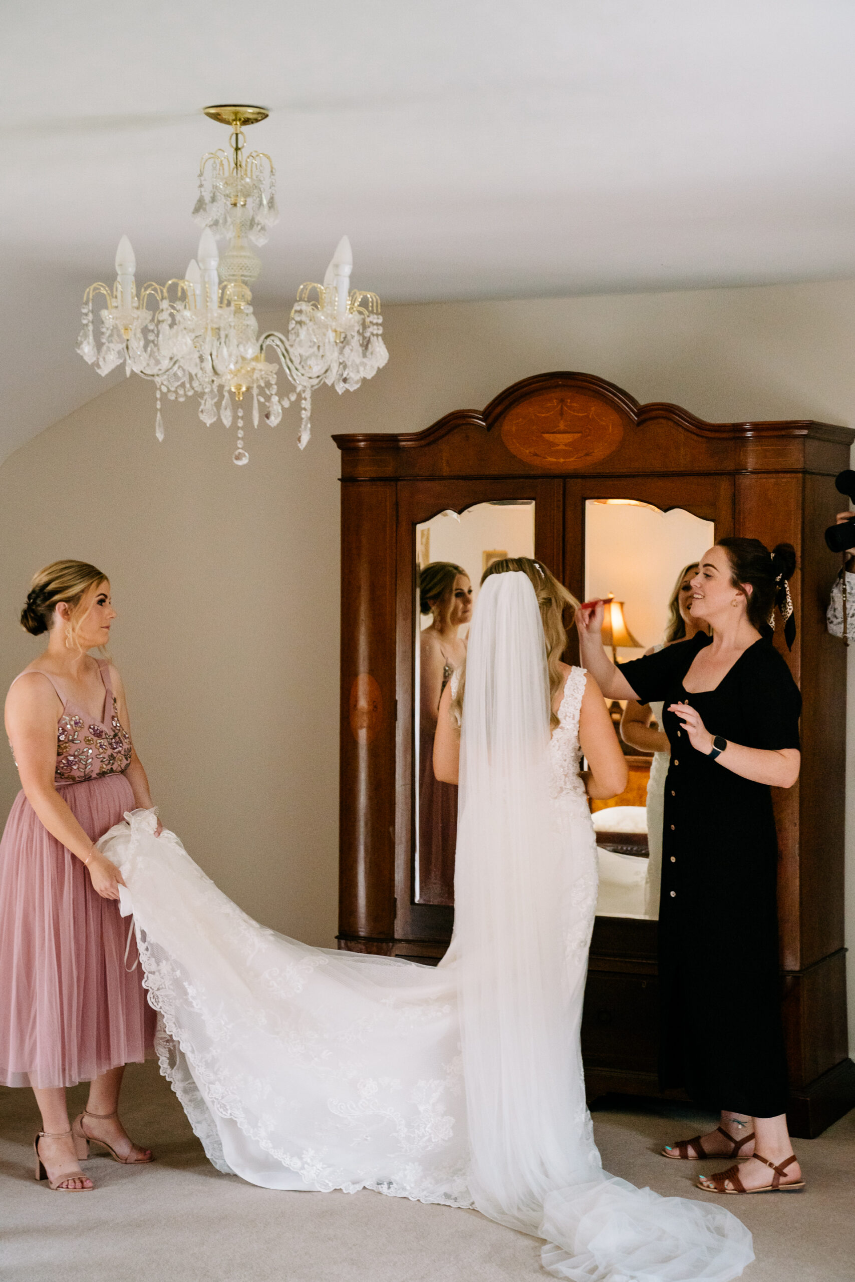 A person in a wedding dress and a person in a dress