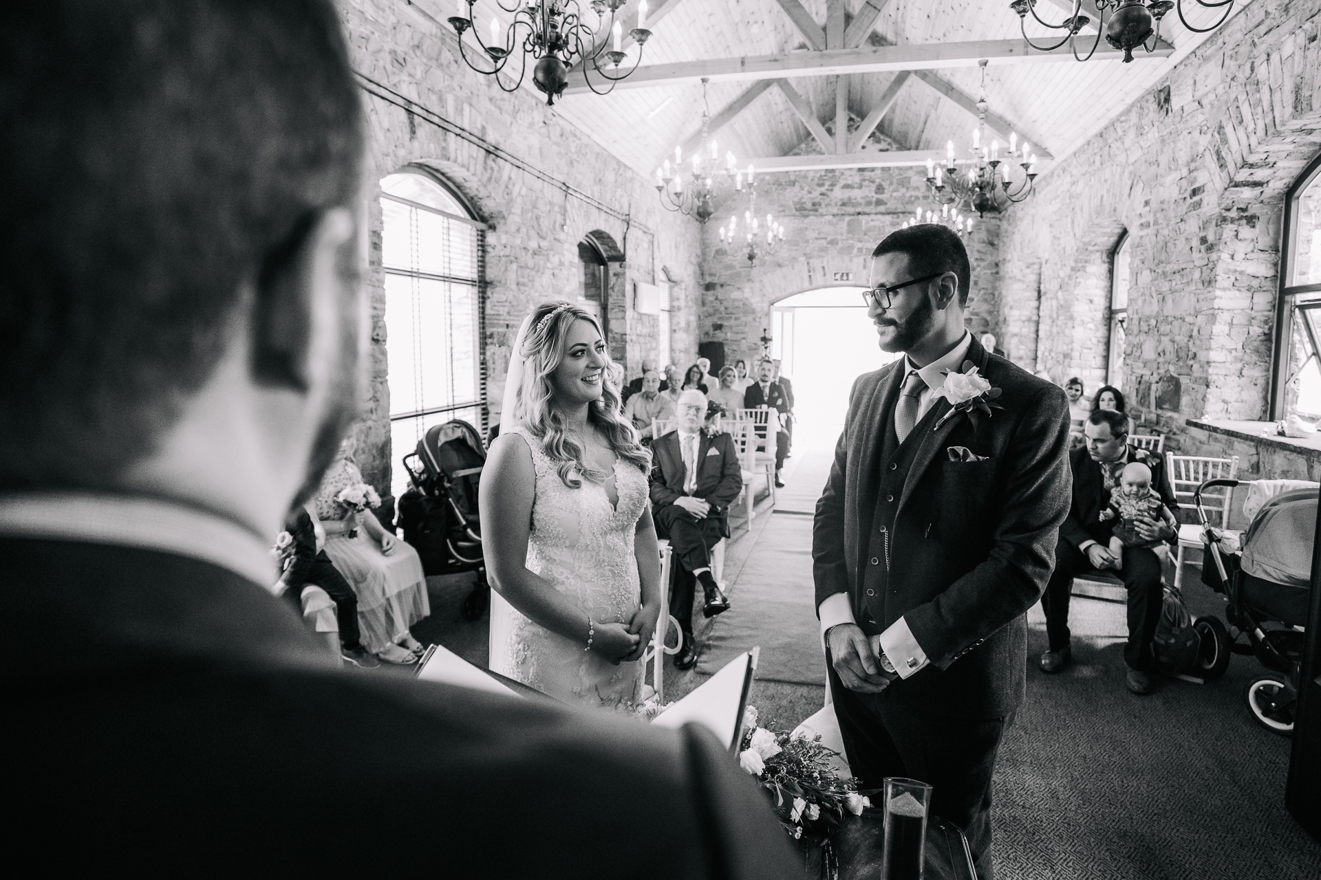 A bride and groom walking down the aisle