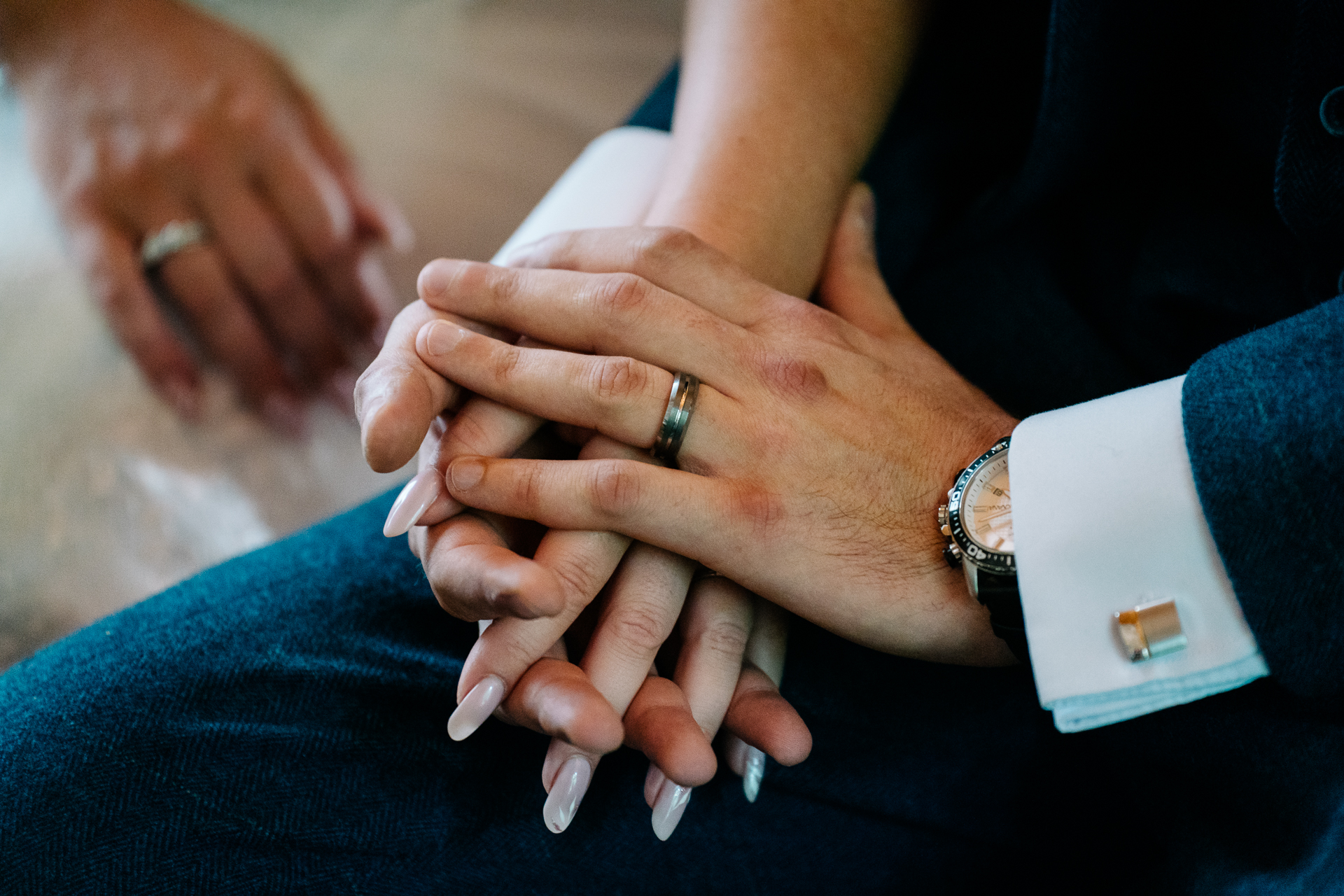 A close-up of hands clasped