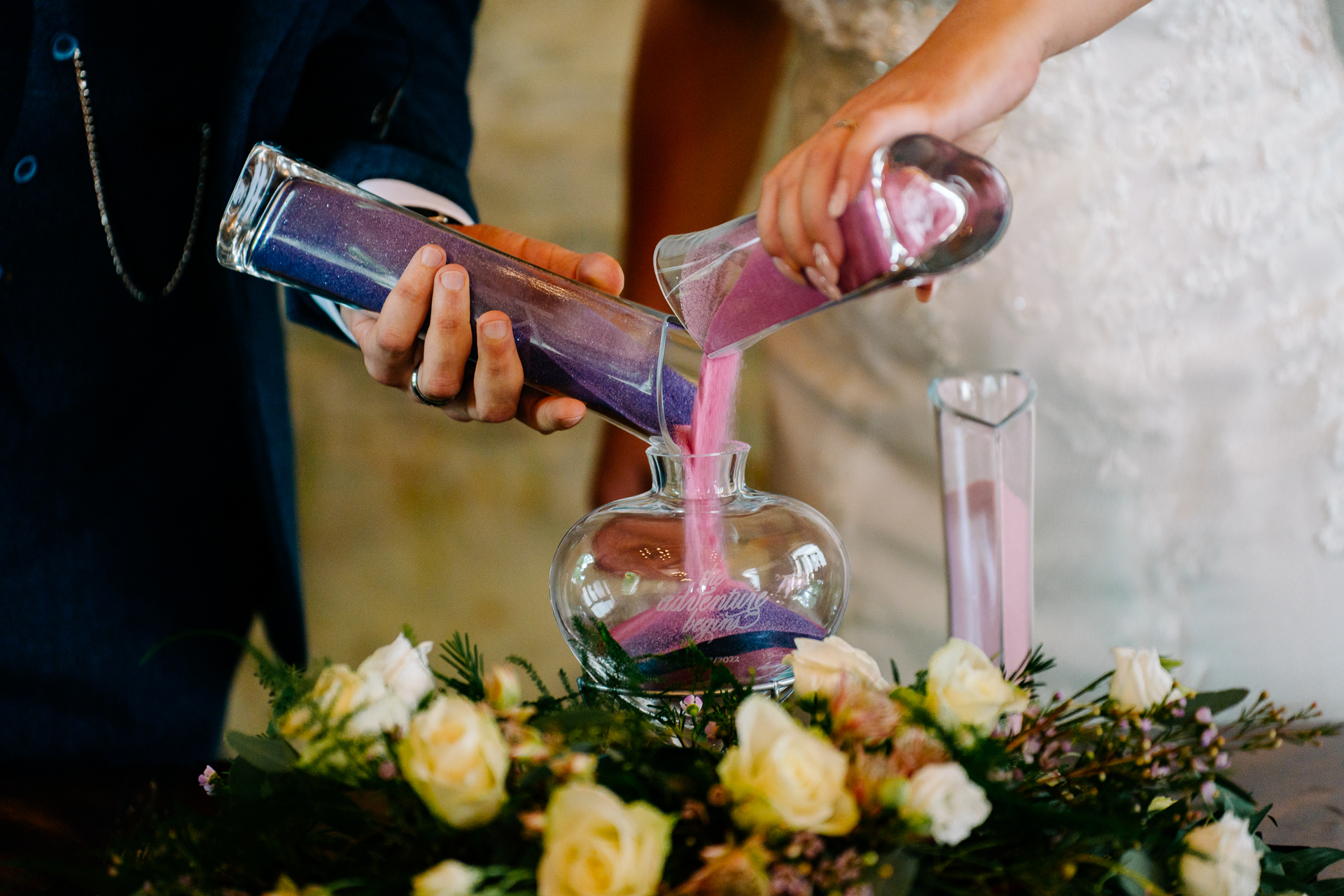 A person pouring a liquid into a glass