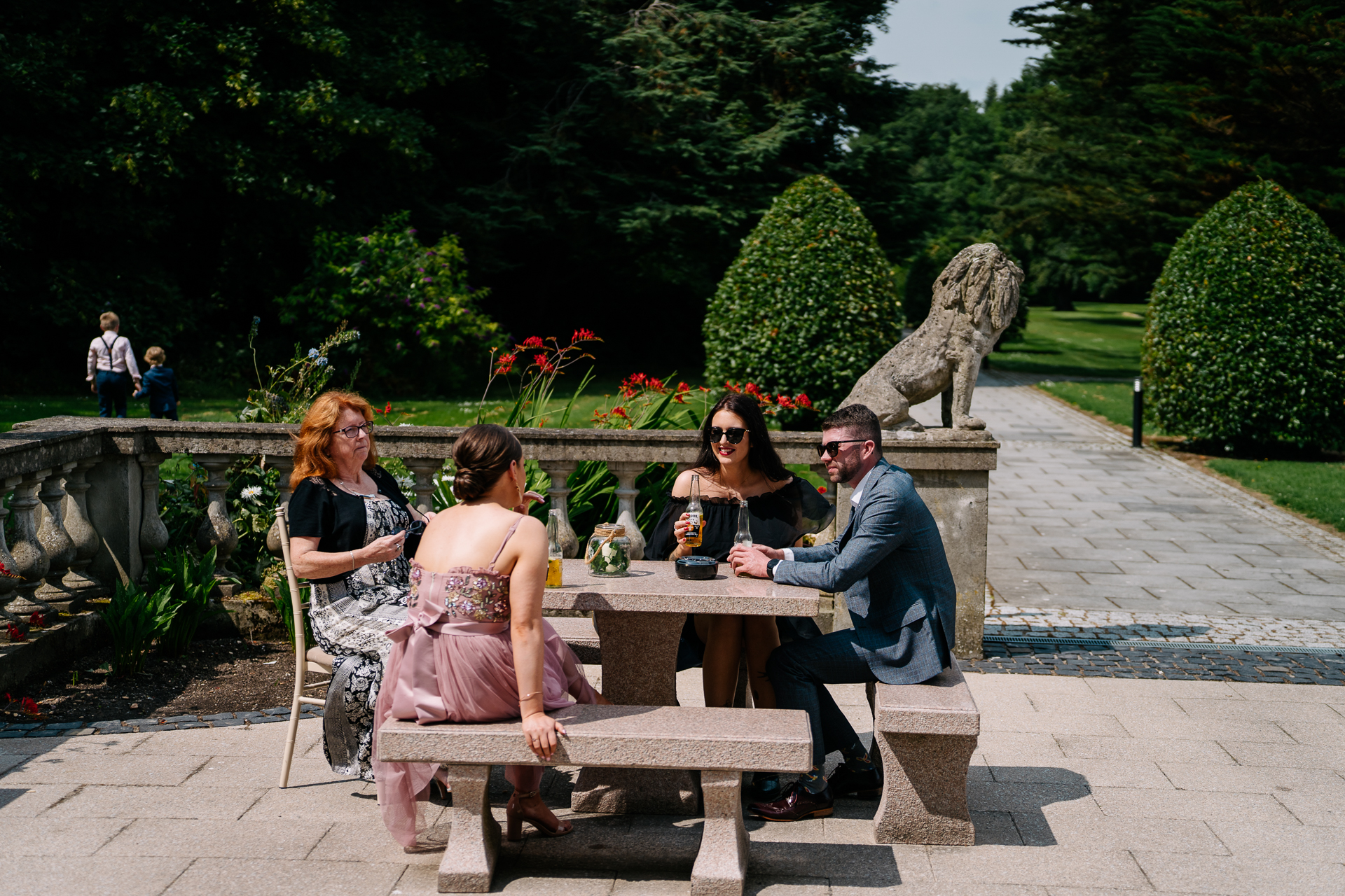 A group of people sitting at a table outside