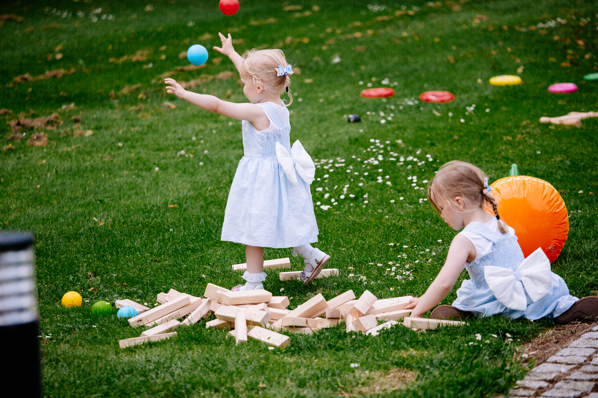 A couple of girls playing with balls