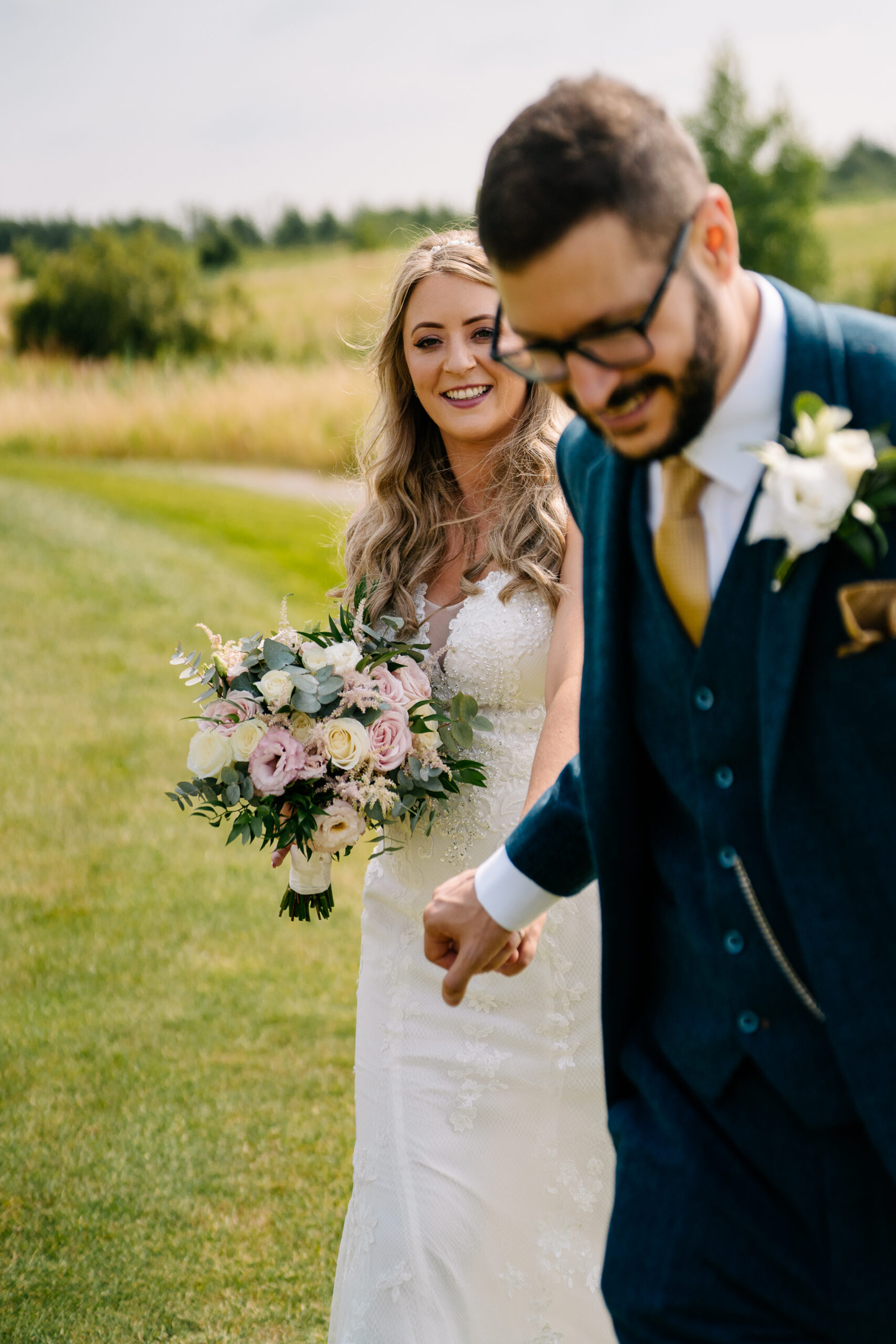 A man and woman holding flowers