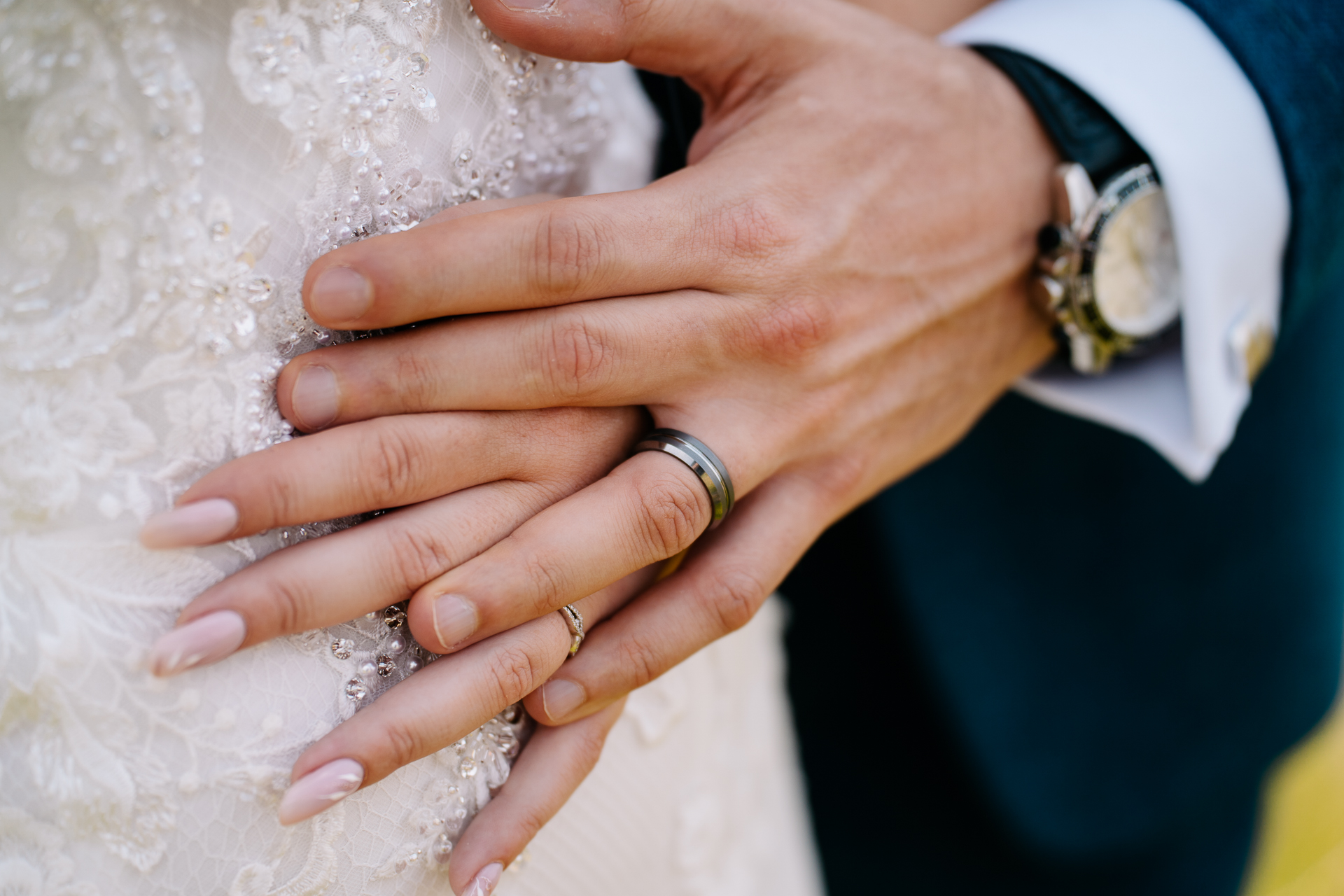 A close-up of hands holding each other