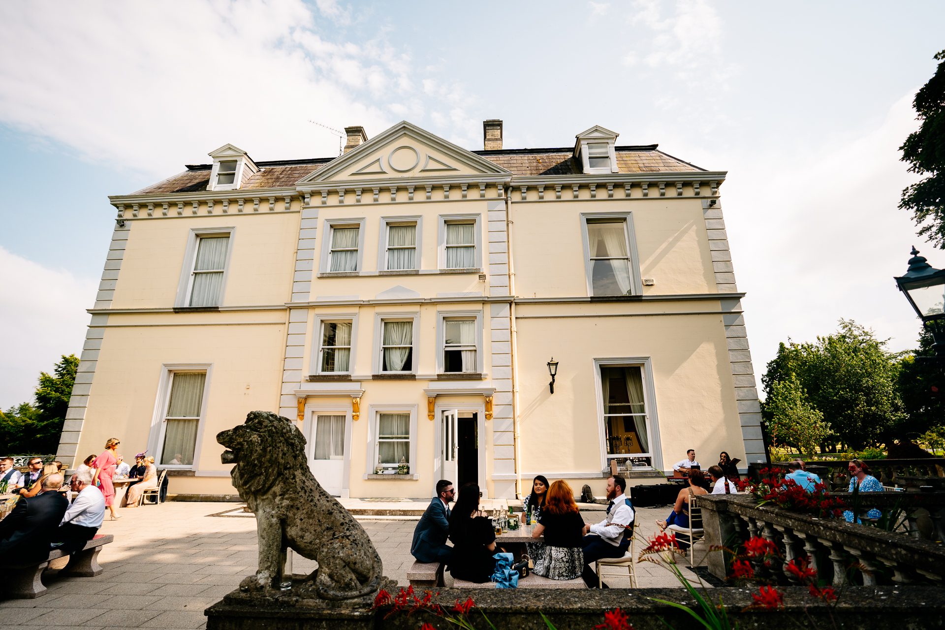 A group of people sitting outside a building