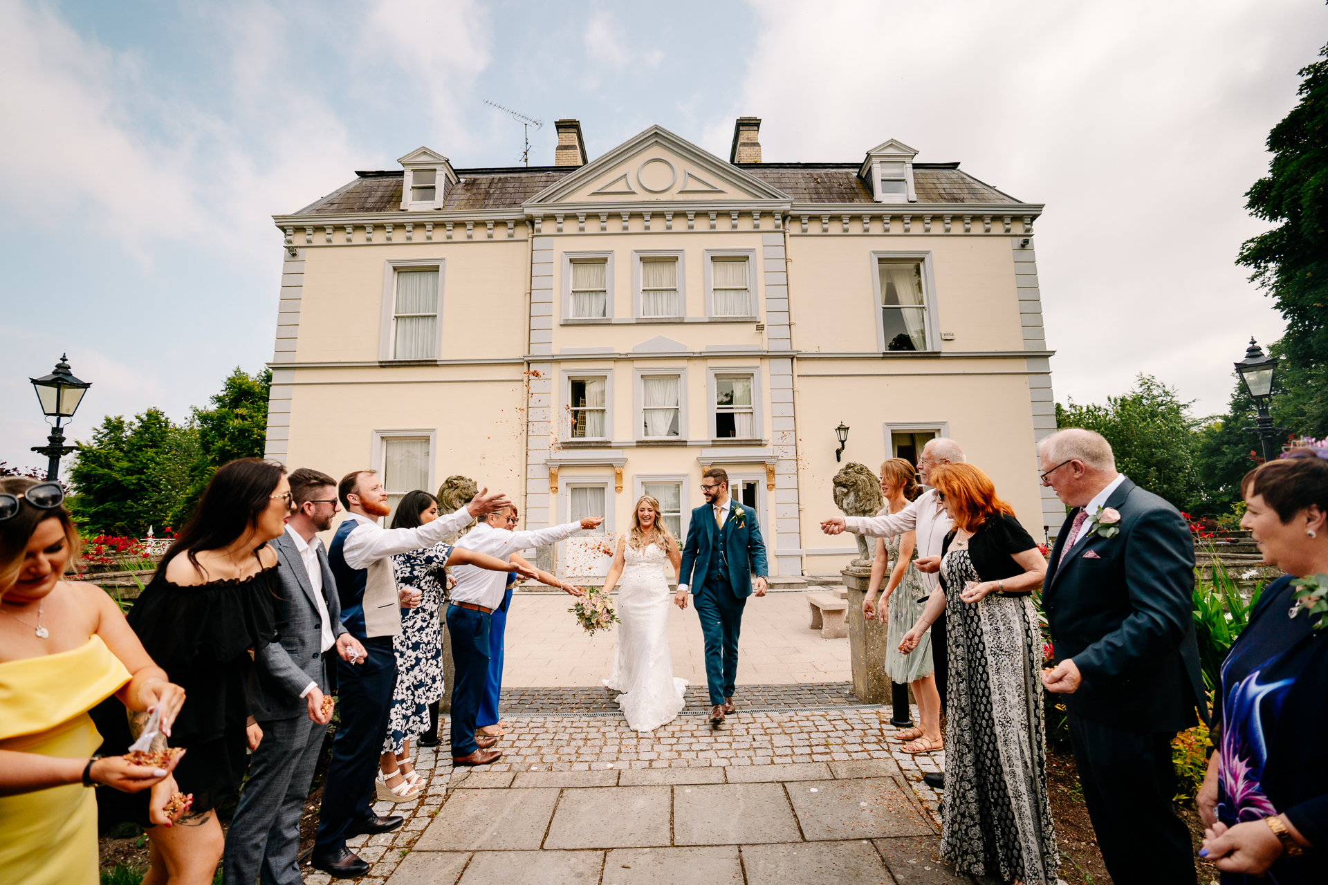 A wedding party outside a large building