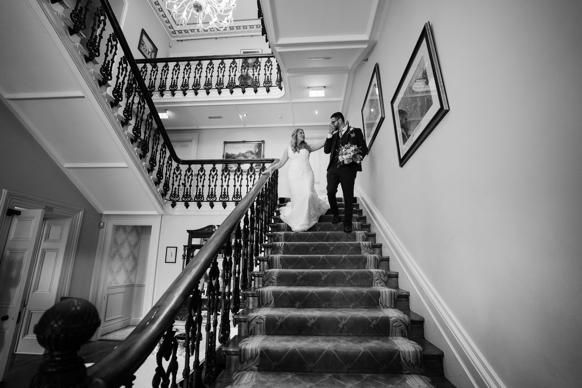 A bride and groom on the stairs