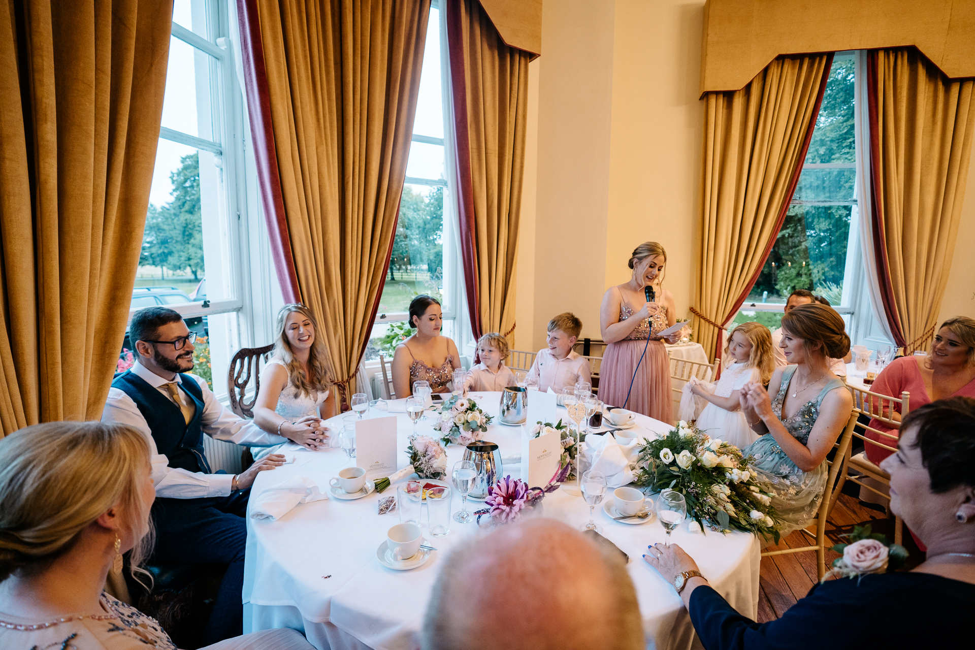 A group of people sitting around a table