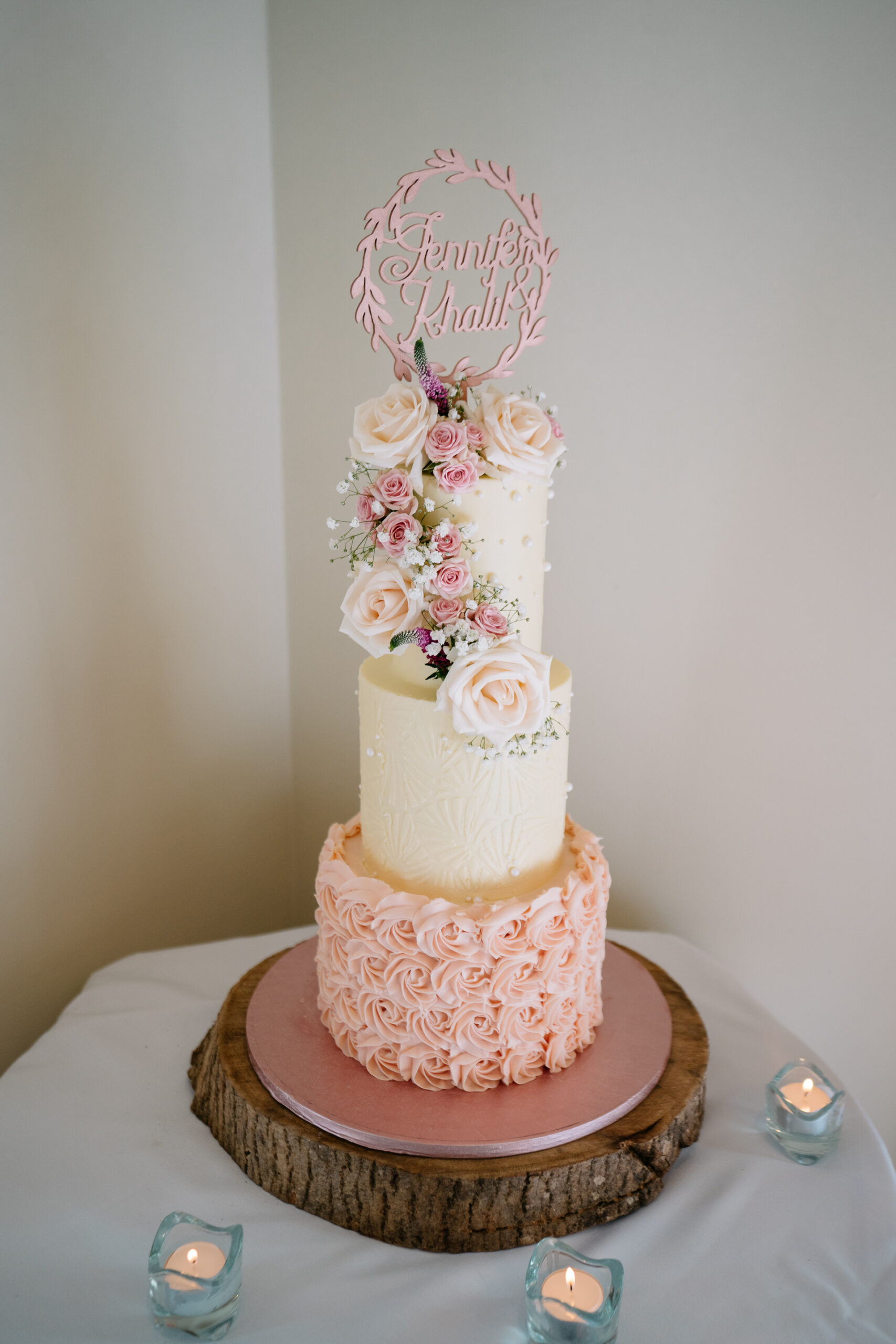 A cake with a pink frosting and a crown on top