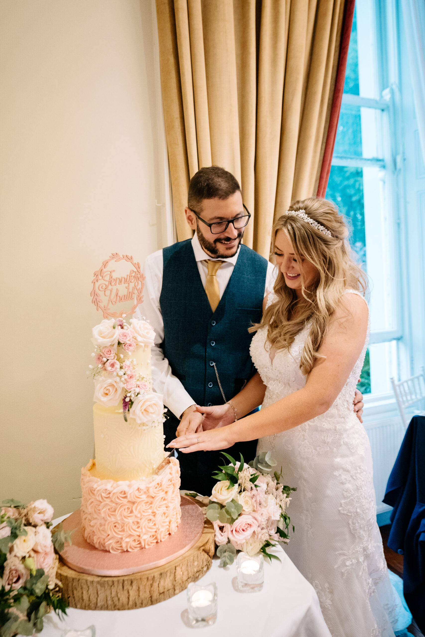 A bride and groom cutting a wedding cake