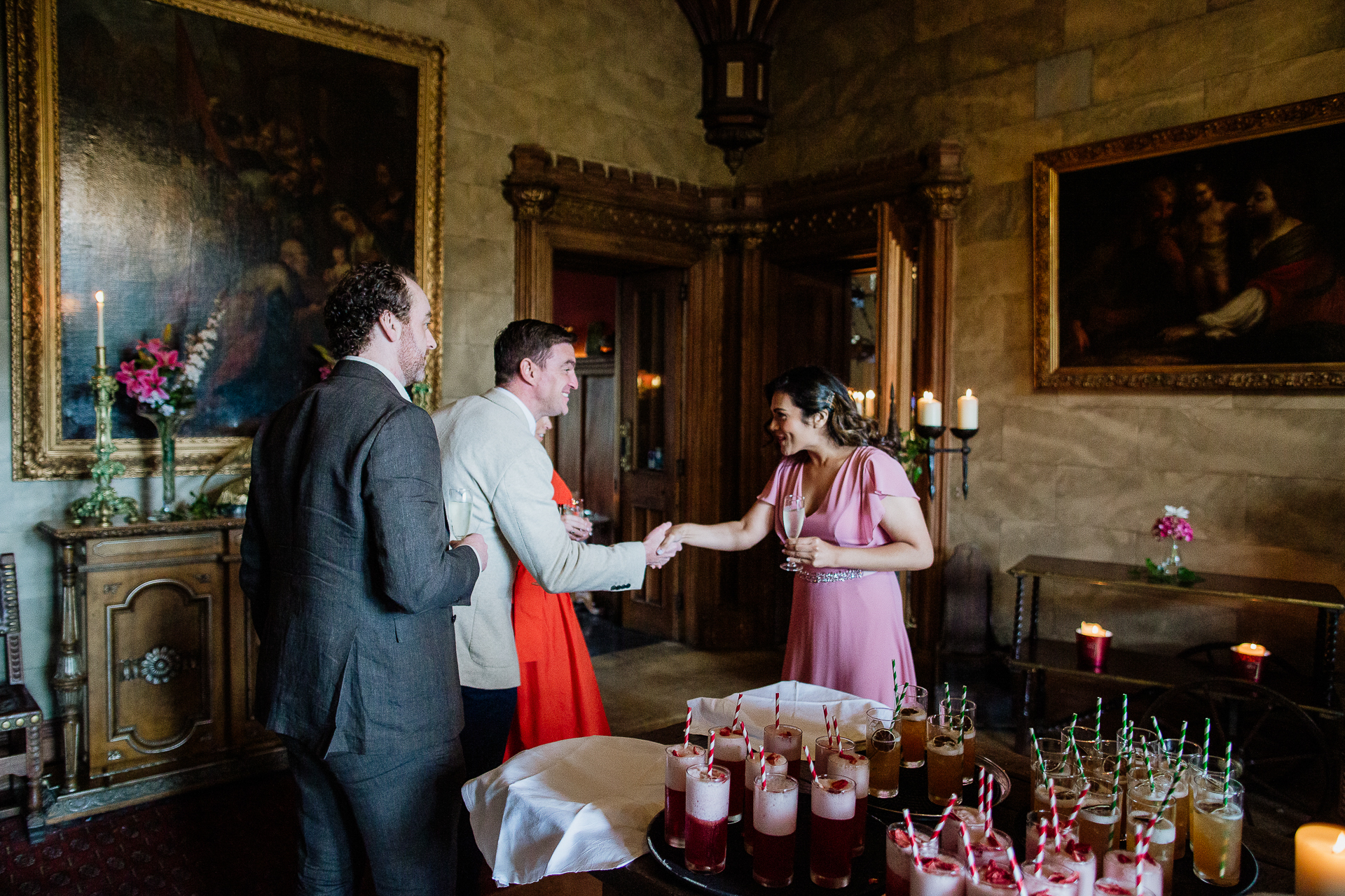 A man and a woman in a room with a table and candles