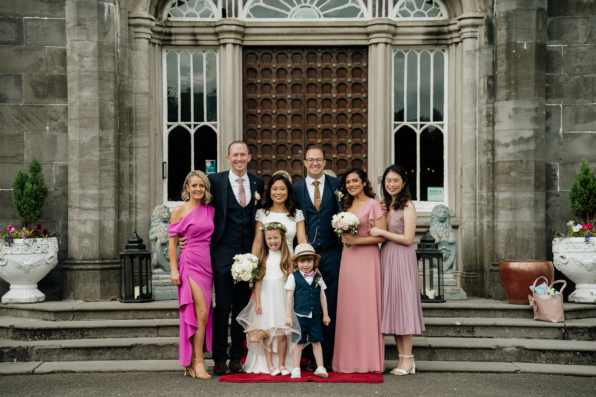 A group of people posing for a photo on steps