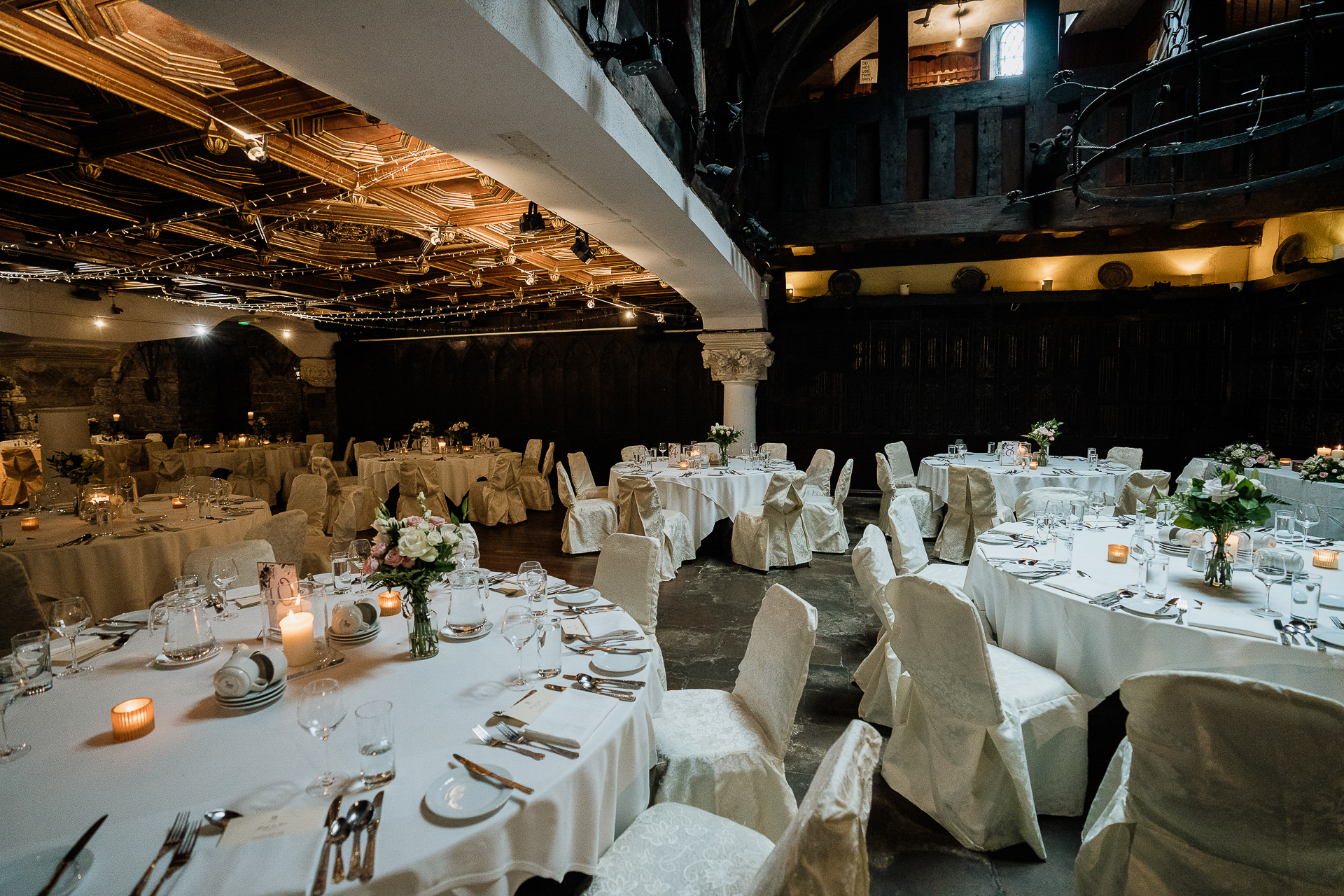 A large room with tables set for a meal